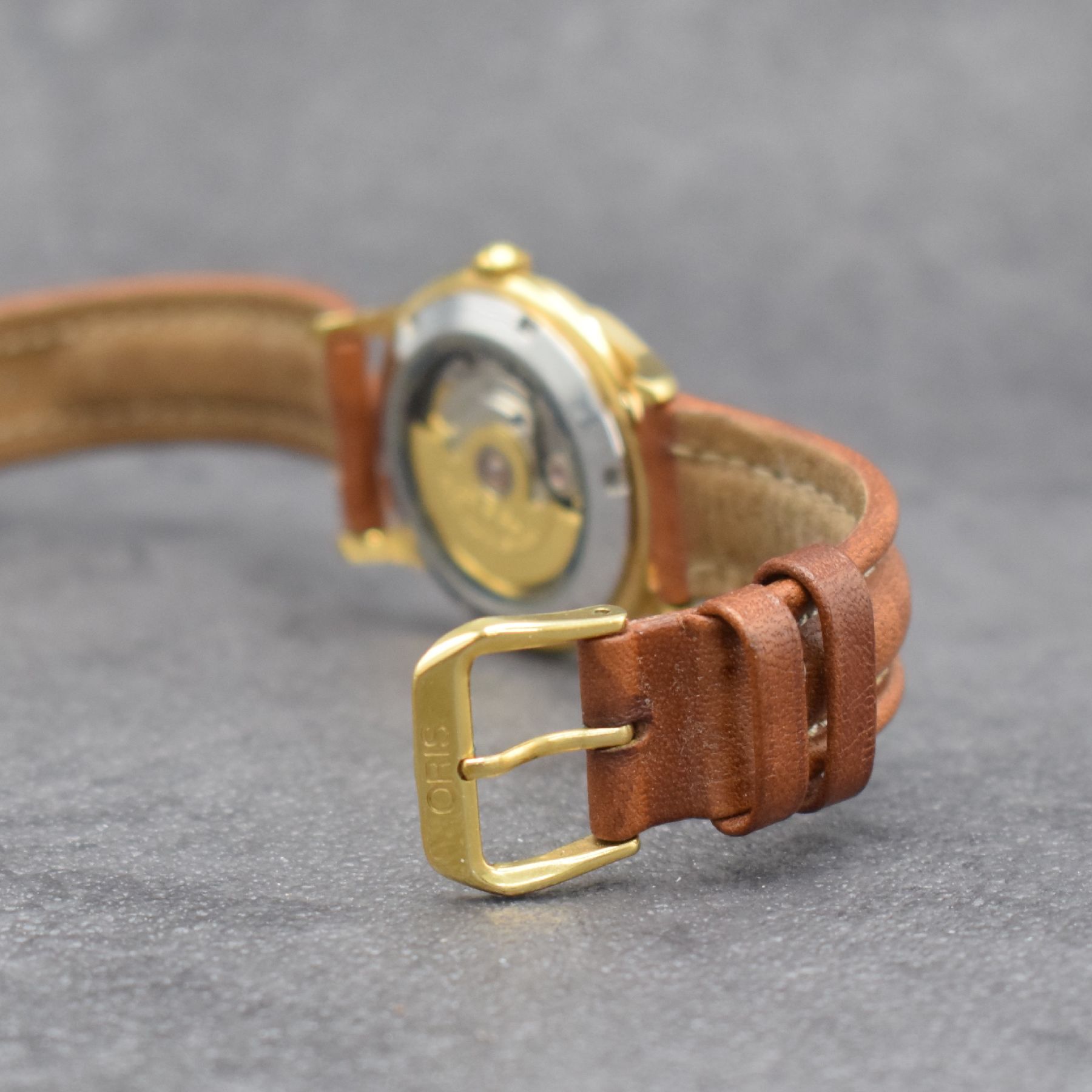 Detail d: ORIS vergoldete Armbanduhr mit Datum, Schweiz um 2000, Automatik, beids. vergl., Ref. 7317, Stahlboden verschr., silb. Duoton- Zifferbl., gold. arab. ...