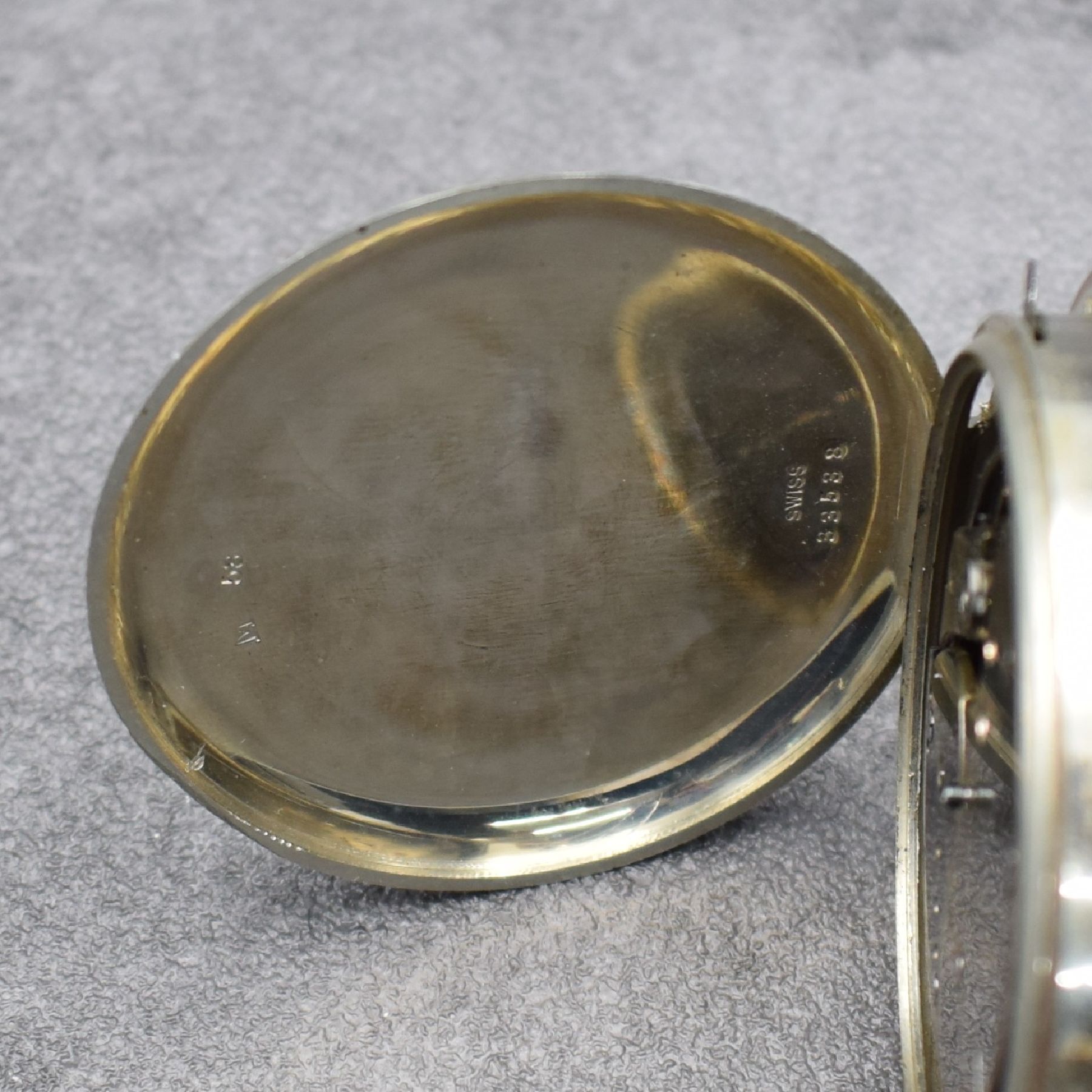 Detail d: Reiseuhr mit 1/4 Std.-Repetition, Schweiz um 1920, Nickel Scharniergeh., vergl. Messing- Lünette, Rep.-Schieber b. 10, Transportgeh. fehlt, verg. ...