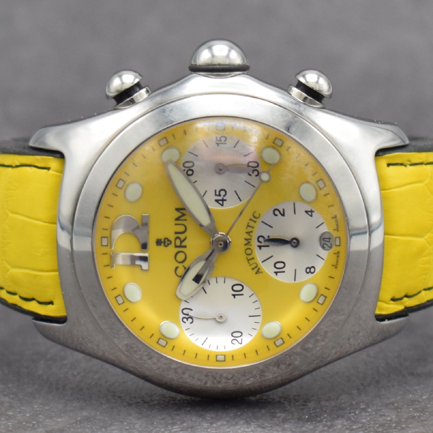 Detail a: CORUM Bubble Armbandchronograph in Stahl, Schweiz um 2010, Automatik, beids. vergl. Geh. Ref. 285.150.20, Boden & Krone verschr., gelbes Zifferbl., ...