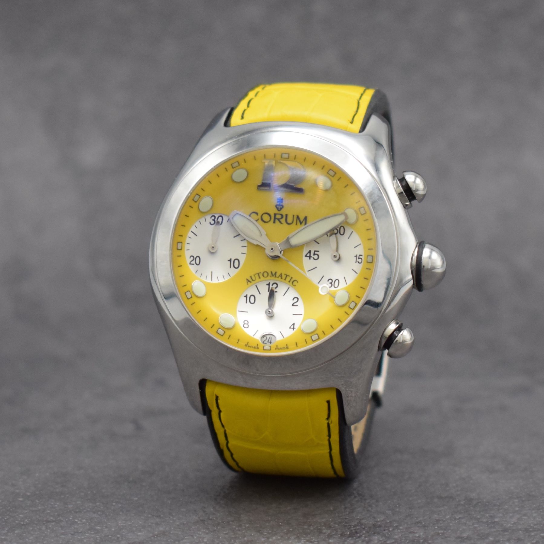 Detail b: CORUM Bubble Armbandchronograph in Stahl, Schweiz um 2010, Automatik, beids. vergl. Geh. Ref. 285.150.20, Boden & Krone verschr., gelbes Zifferbl., ...