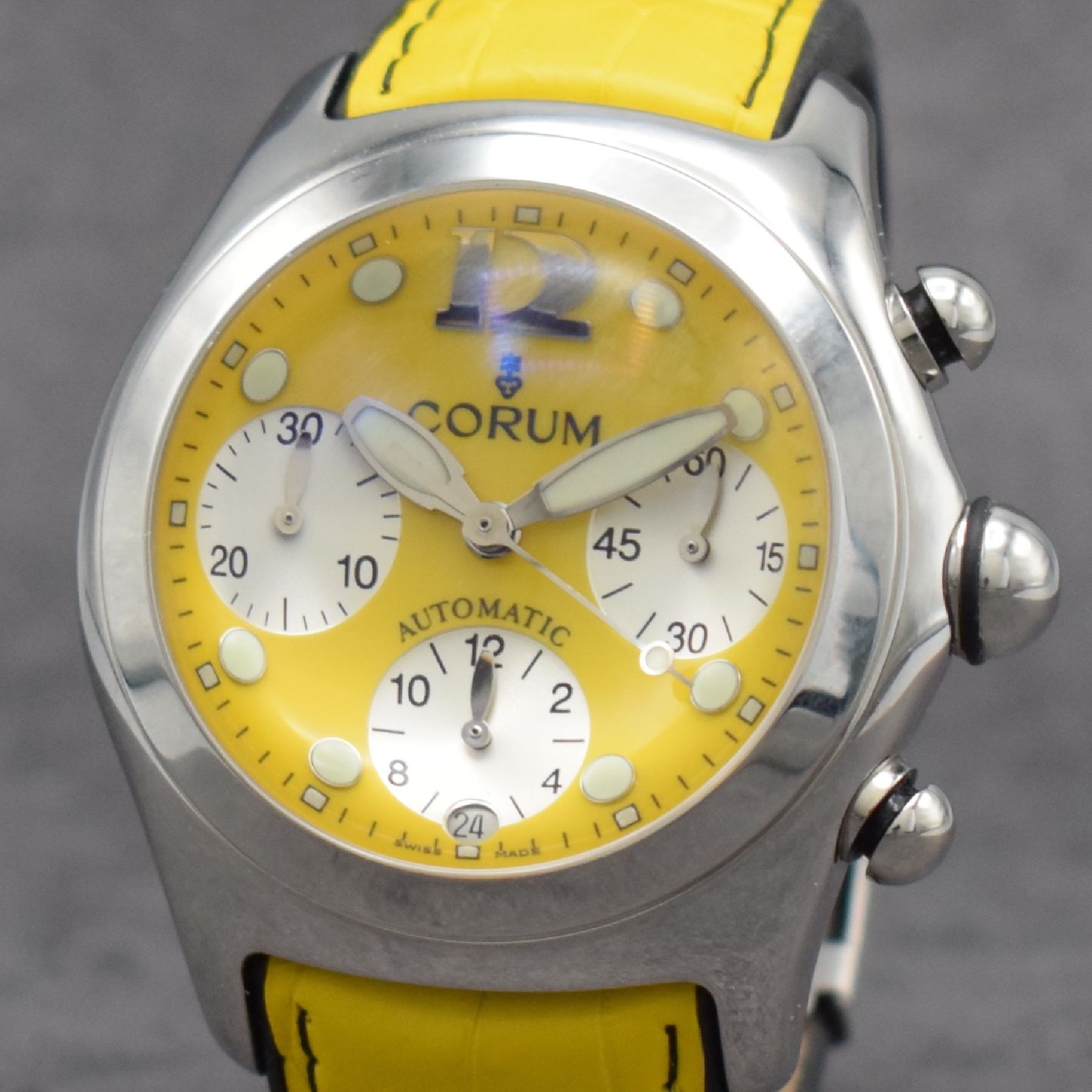 Detail c: CORUM Bubble Armbandchronograph in Stahl, Schweiz um 2010, Automatik, beids. vergl. Geh. Ref. 285.150.20, Boden & Krone verschr., gelbes Zifferbl., ...
