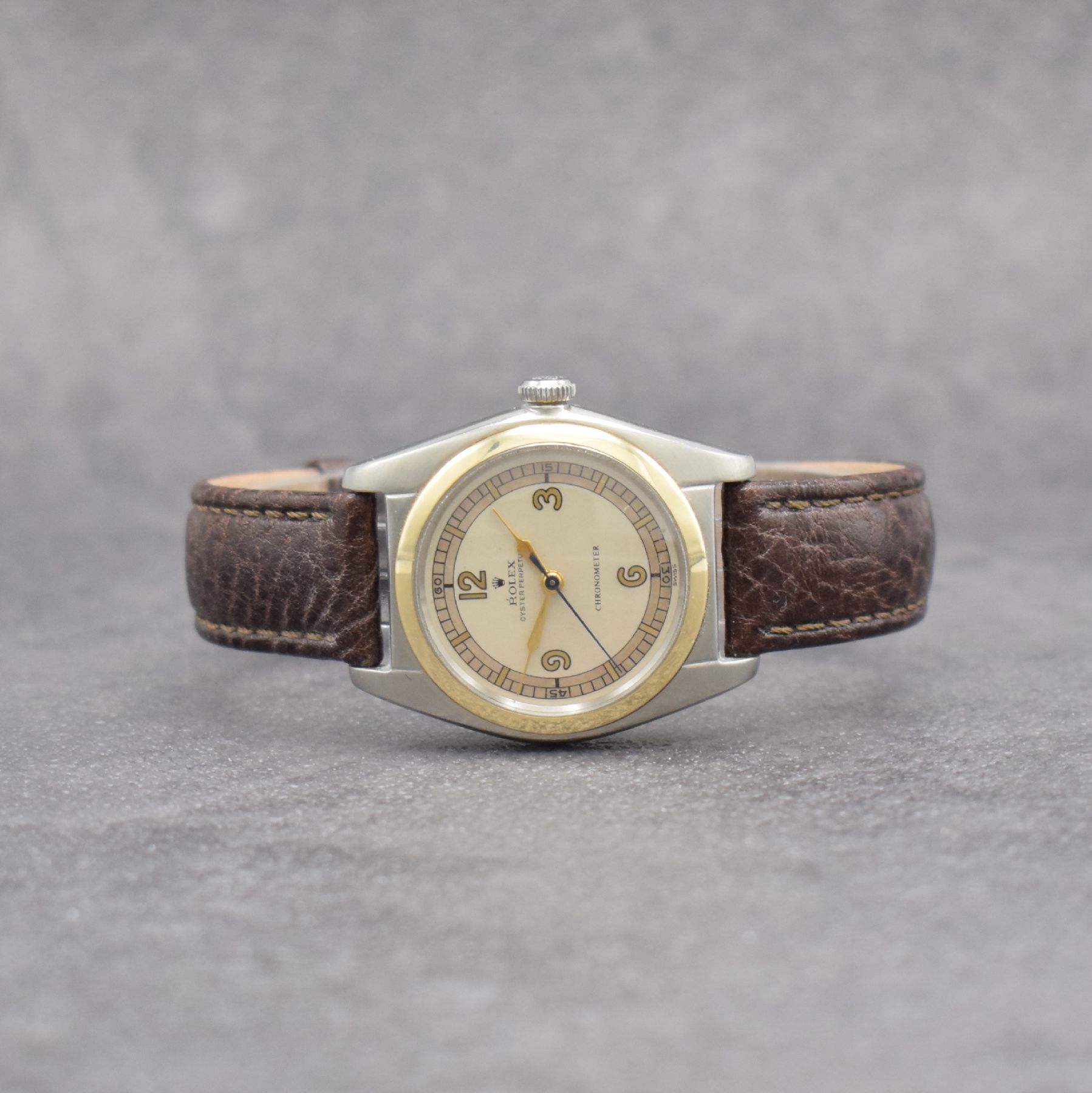 ROLEX Chronometer Herrenarmbanduhr Oyster Perpetual Bubble Back in Stahl mit Goldlünette Referenz 4392, Automatik, Schweiz um 1949, Lederband m. ...