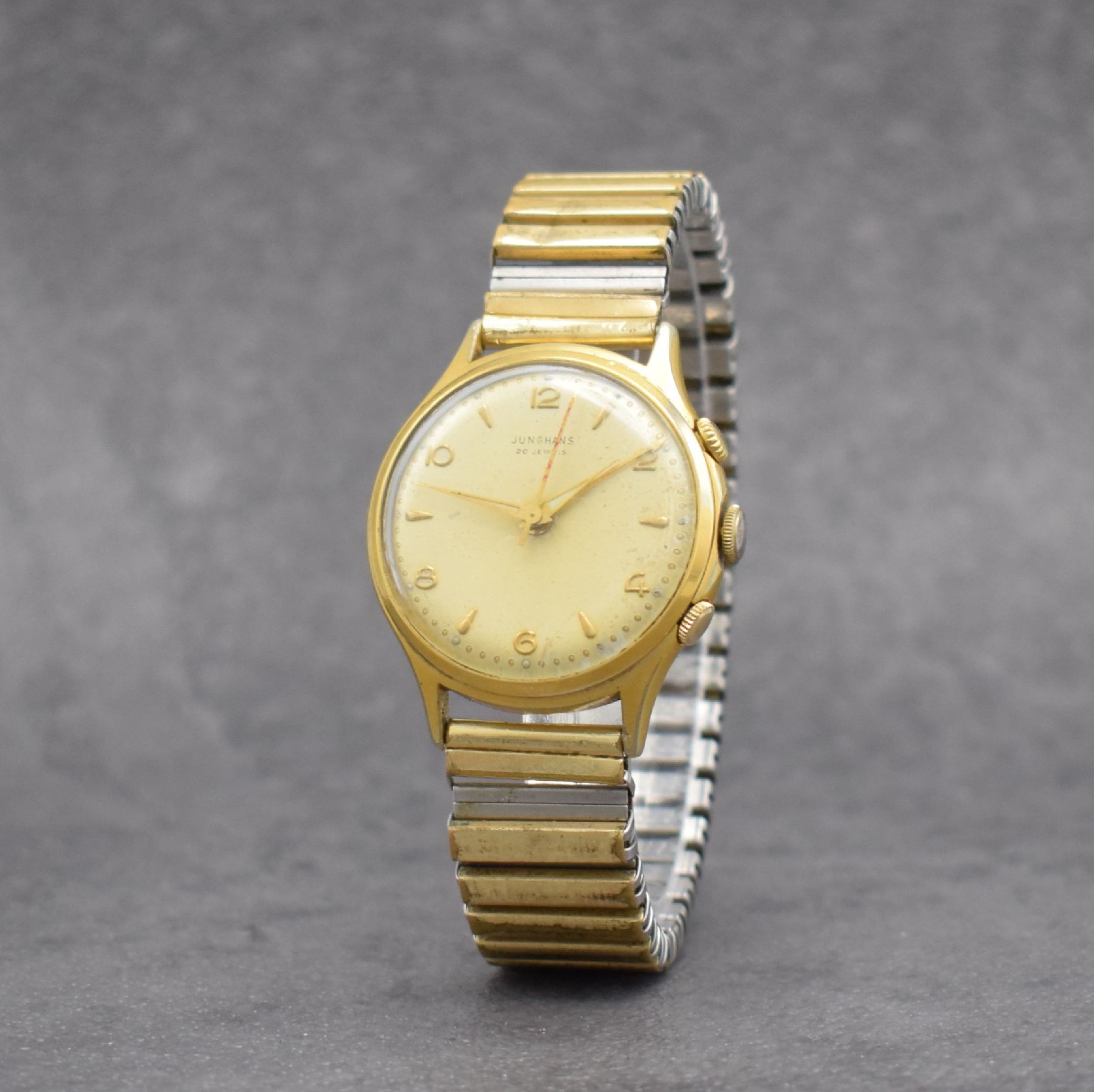 Detail b: JUNGHANS Armbandwecker Kaliber 89, Deutschland um 1960, Handaufzug, verg. Metallgeh. altersbed. ber., 20 St., Geh- & Weckw. 1 Federhaus, ...