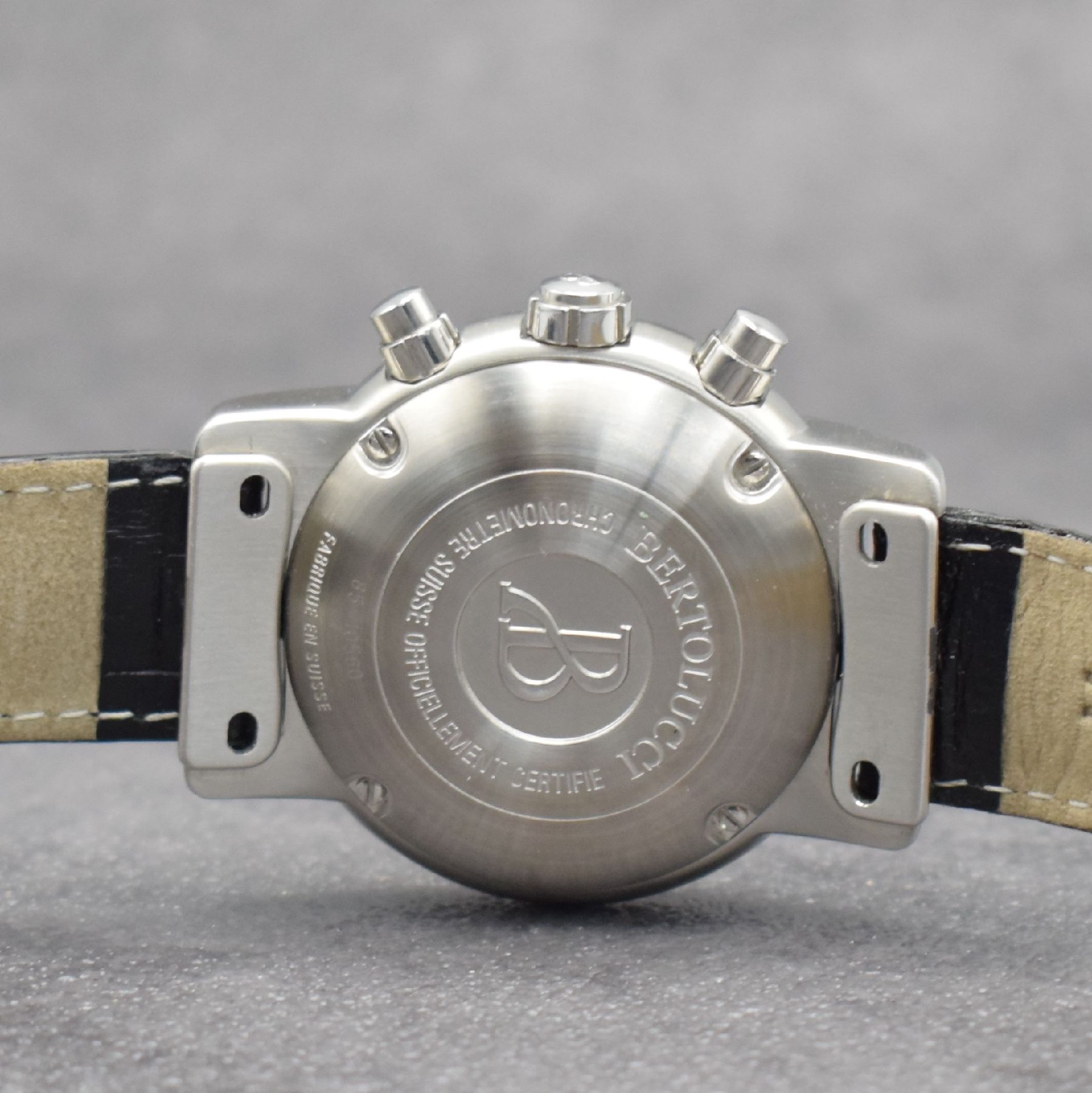 Detail f: BERTOLUCCI Chronometer Chronograph in Stahl, Schweiz um 2000, Automatik, 4-fach verschr. Geh. m. ausgefallenen Anstößen, schwarzes Zifferbl., ...
