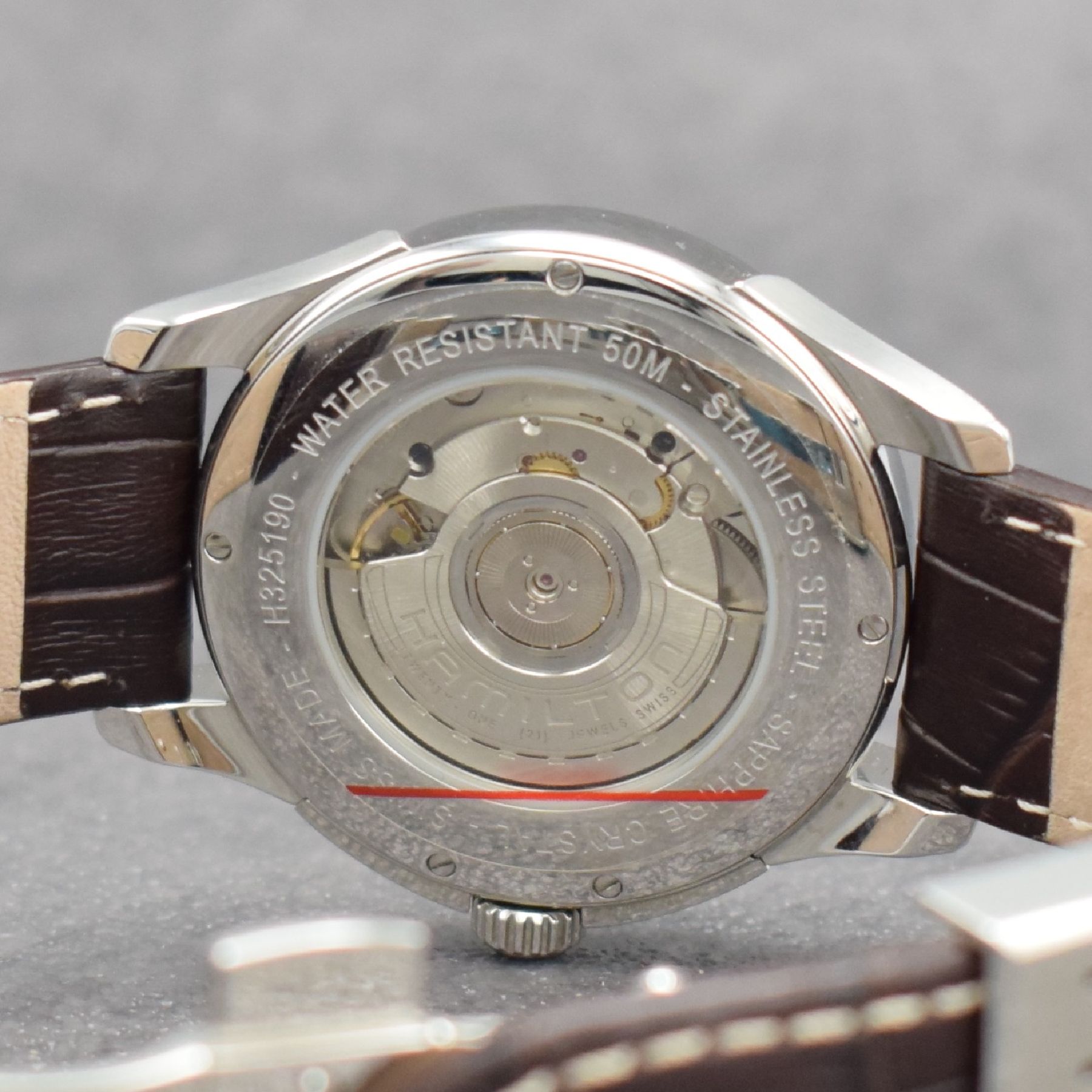 Detail f: HAMILTON Jazzmaster Herrenarmbanduhr mit Gangreserveanzeige, Schweiz um 2008, Automatik, Ref. H325190, beids. vergl. Edelstahlgeh., Boden verschr., ...