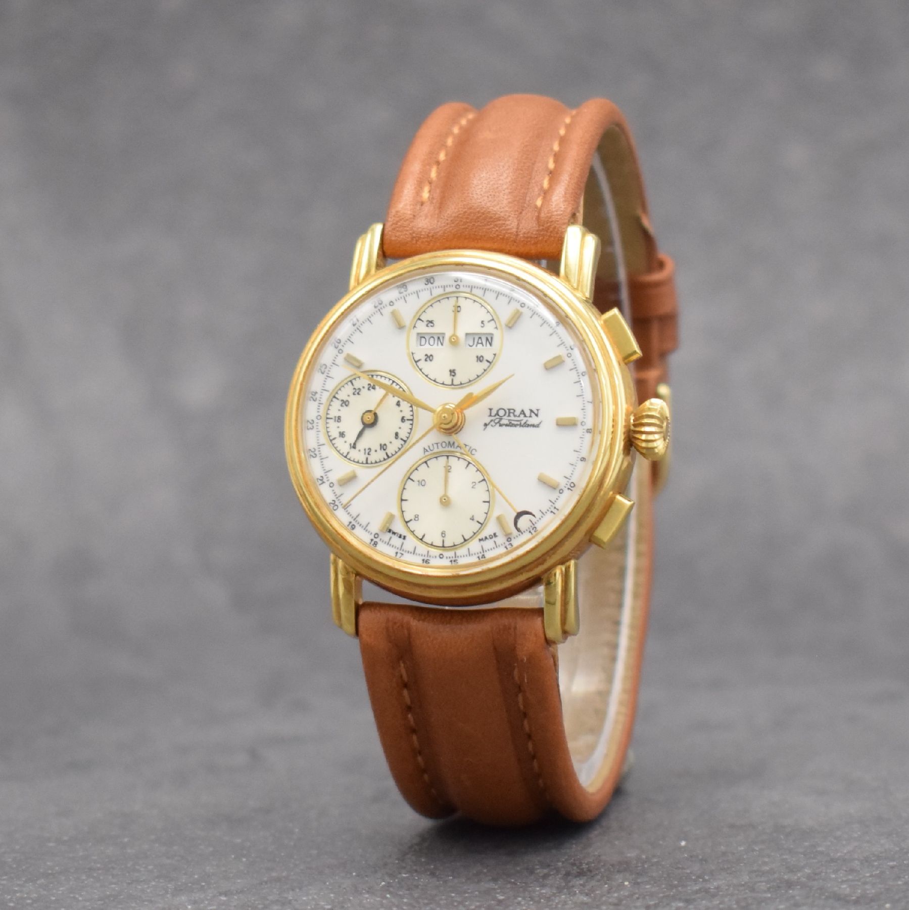 Detail b: LORAN Herrenarmbanduhr mit Chronograph & Kalender in GG 750/000, Schweiz um 1990, Automatik, 3-teil. Geh., Boden & Glasrand aufgedr., weißes ...
