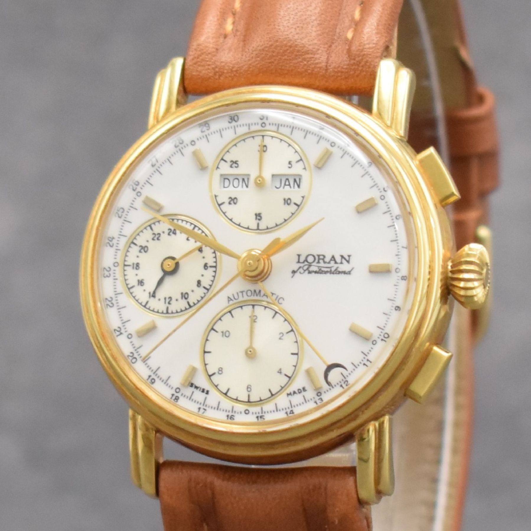 Detail c: LORAN Herrenarmbanduhr mit Chronograph & Kalender in GG 750/000, Schweiz um 1990, Automatik, 3-teil. Geh., Boden & Glasrand aufgedr., weißes ...