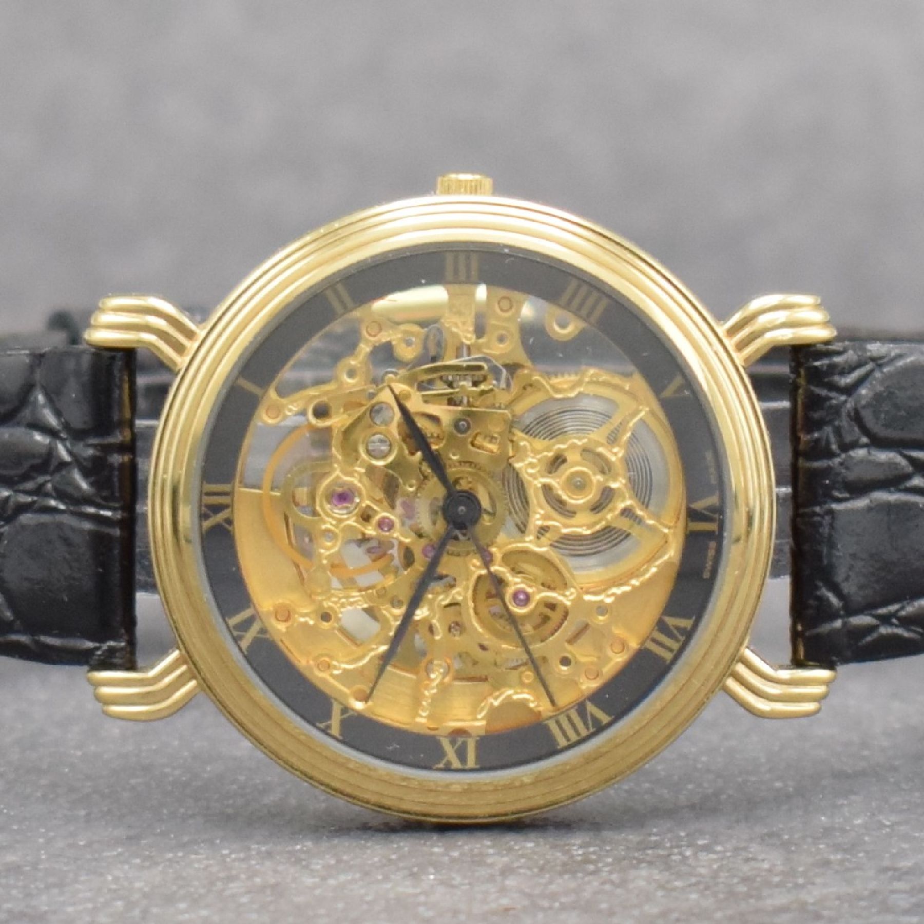 Detail a: ROAMER skelettierte Herrenarmbanduhr, Automatik, Schweiz um 1990, verg. Geh. beids. vergl., äußerer Zifferblattring m. röm. Std., Anz. v. Std., ...