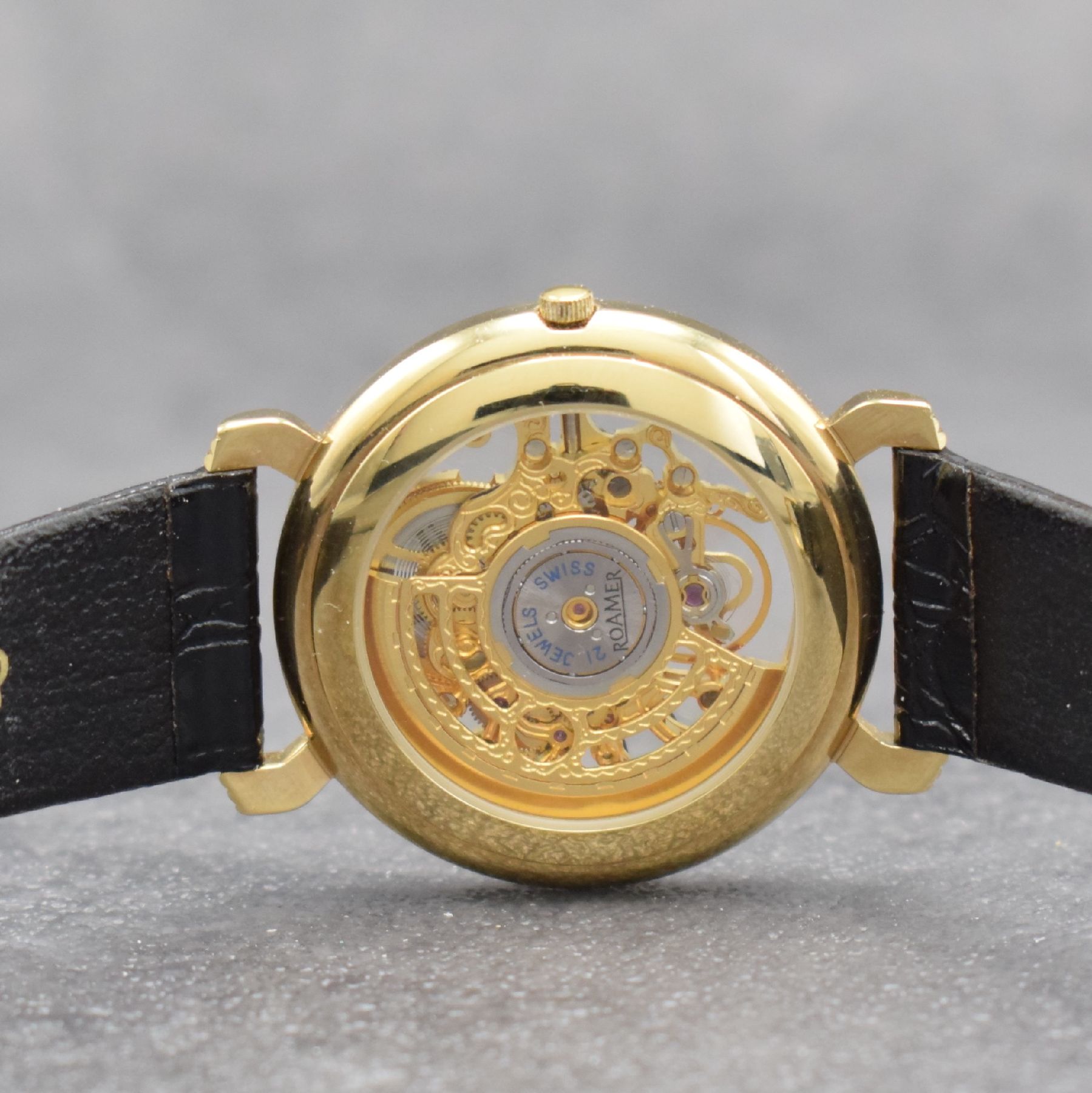 Detail d: ROAMER skelettierte Herrenarmbanduhr, Automatik, Schweiz um 1990, verg. Geh. beids. vergl., äußerer Zifferblattring m. röm. Std., Anz. v. Std., ...
