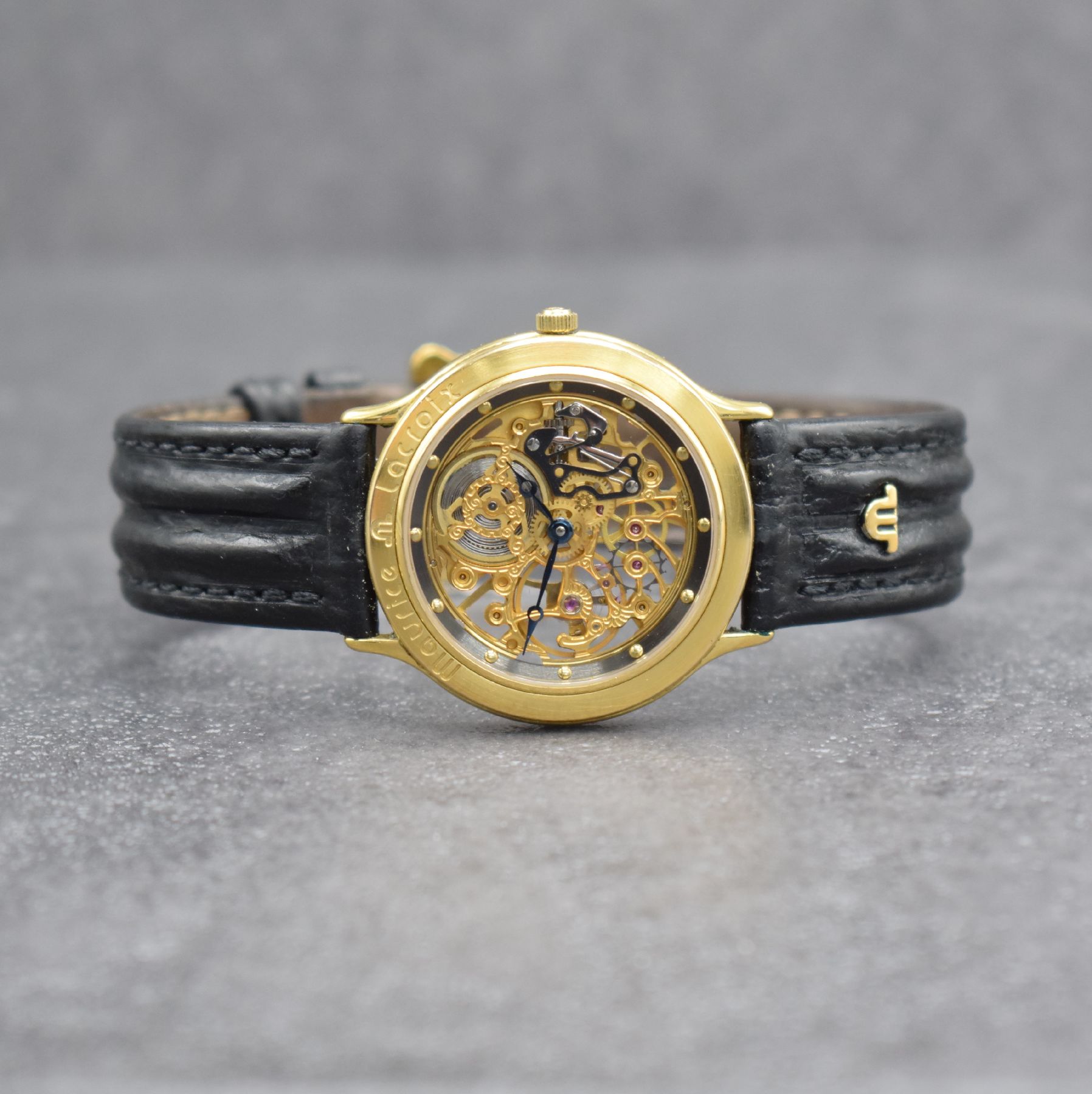 MAURICE LACROIX skelettierte Armbanduhr, Schweiz verk. lt. Pap. 07/1988, Handaufzug, verg. Geh. beids. vergl., Boden aufgedr., orig. Lederband m. ...