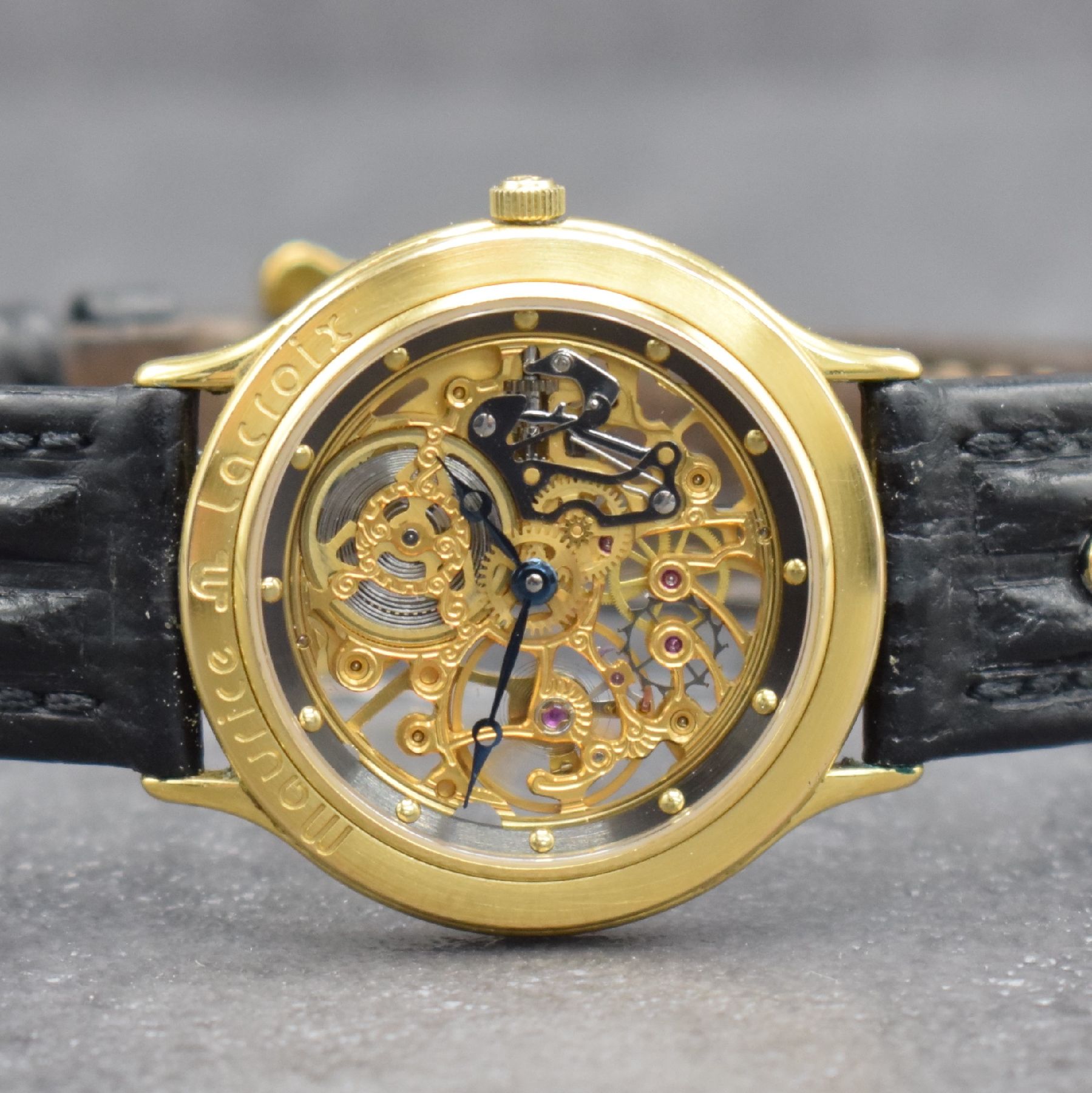Detail a: MAURICE LACROIX skelettierte Armbanduhr, Schweiz verk. lt. Pap. 07/1988, Handaufzug, verg. Geh. beids. vergl., Boden aufgedr., orig. Lederband m. ...