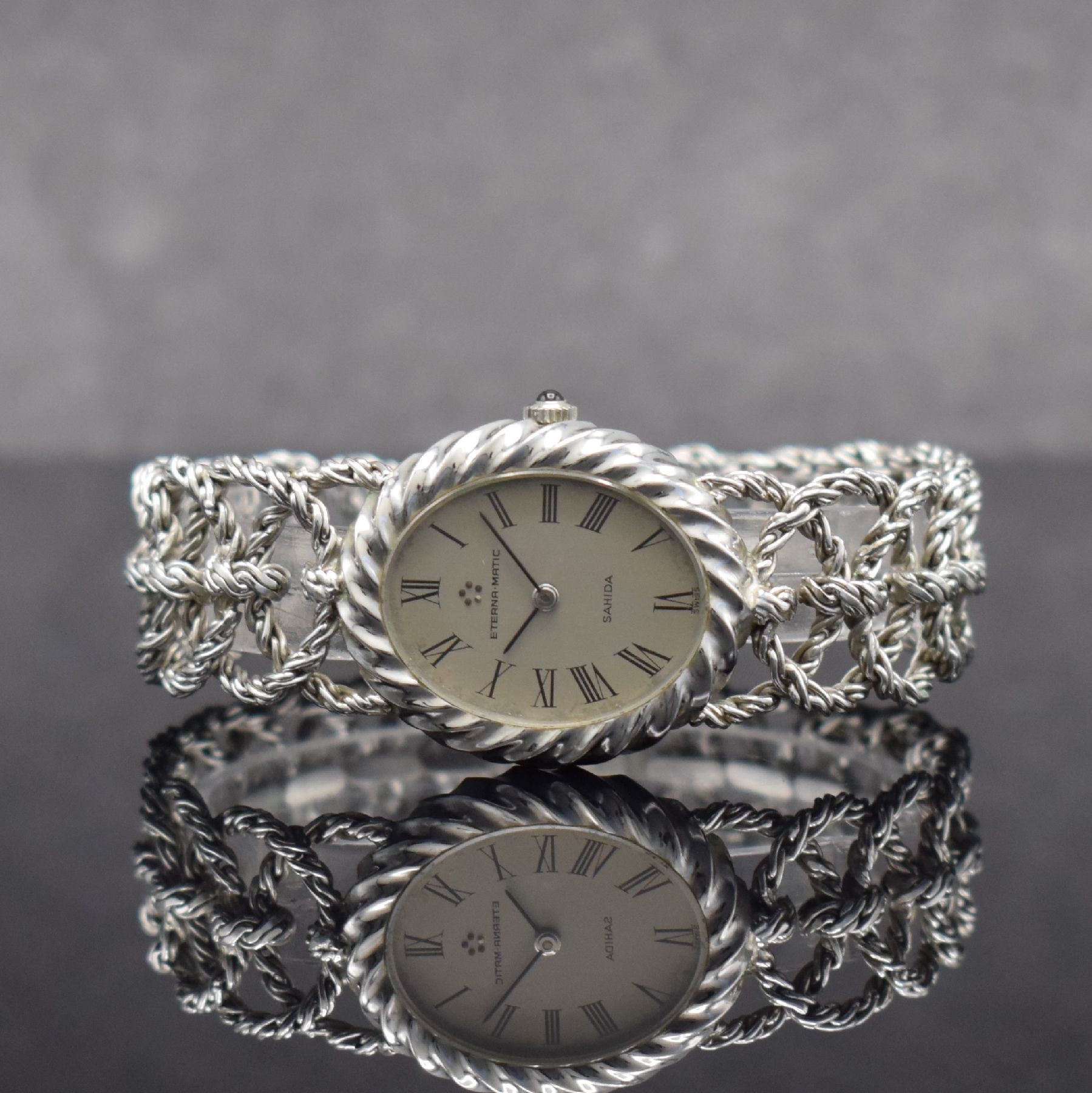 ETERNA-MATIC ausgefallene Damenarmbanduhr in WG 750/000, Schweiz um 1970, Automatik, Boden aufgedr., aufwendiges Flechtband in WG 750/000, silb. ...