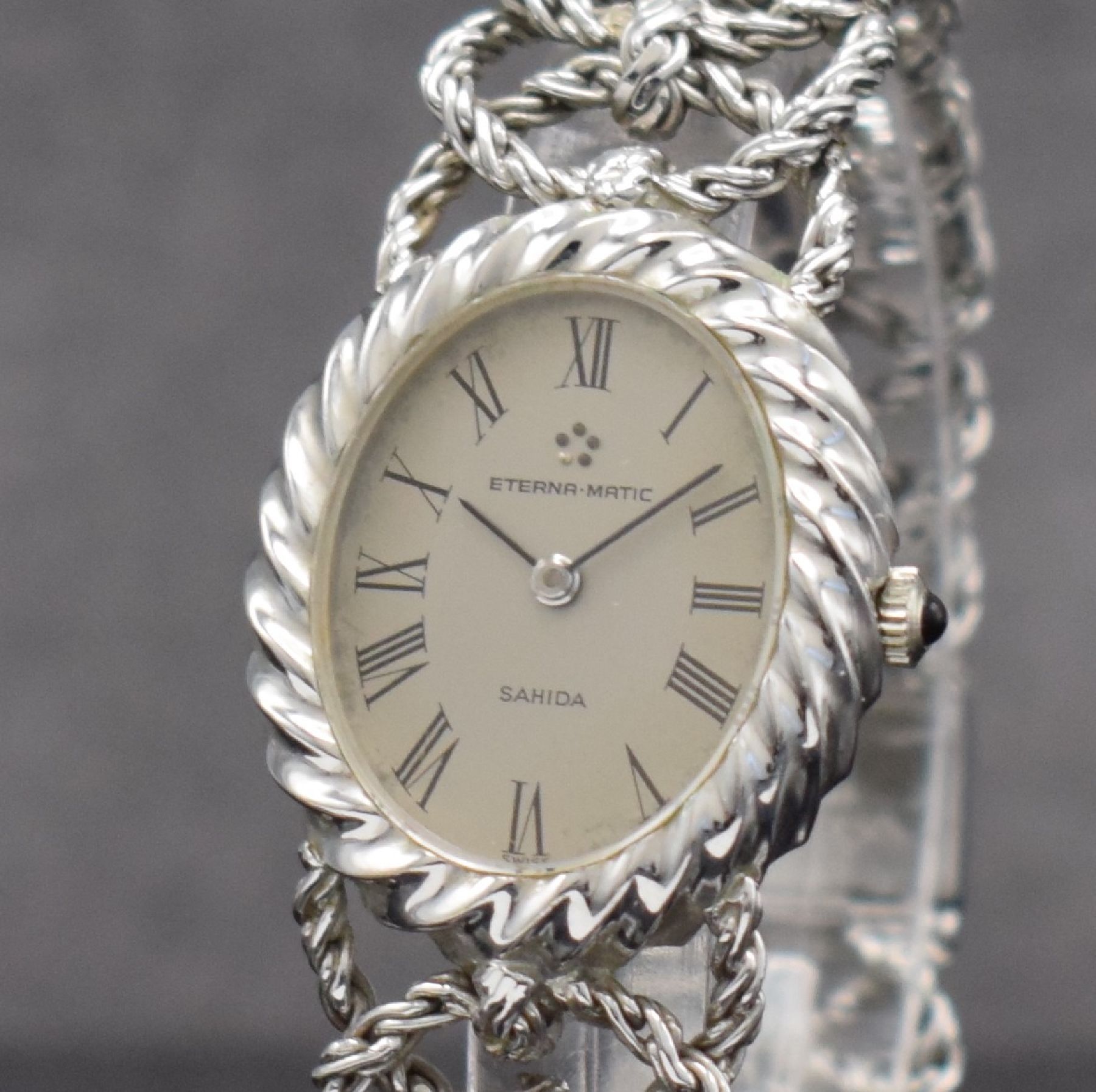 Detail c: ETERNA-MATIC ausgefallene Damenarmbanduhr in WG 750/000, Schweiz um 1970, Automatik, Boden aufgedr., aufwendiges Flechtband in WG 750/000, silb. ...