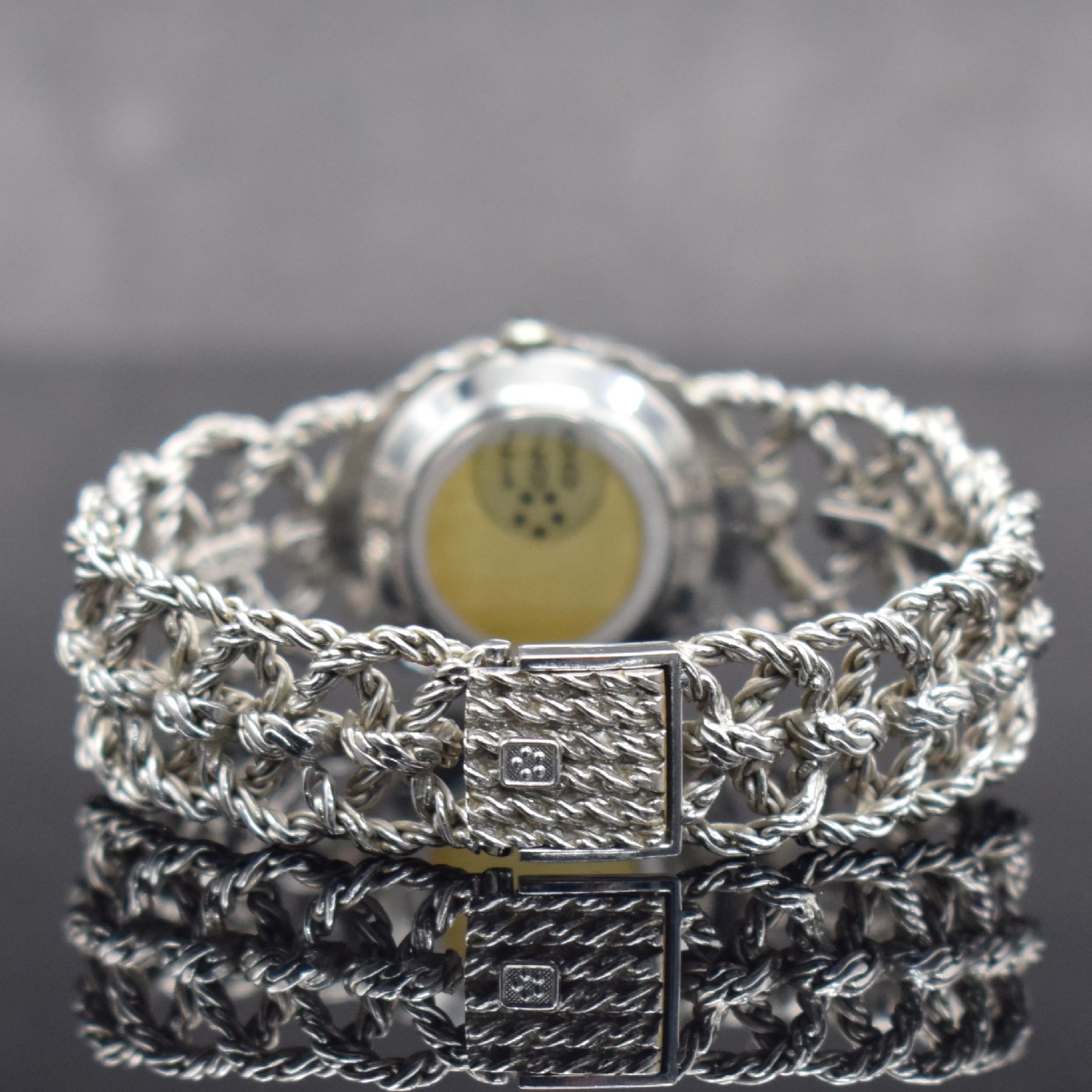 Detail d: ETERNA-MATIC ausgefallene Damenarmbanduhr in WG 750/000, Schweiz um 1970, Automatik, Boden aufgedr., aufwendiges Flechtband in WG 750/000, silb. ...