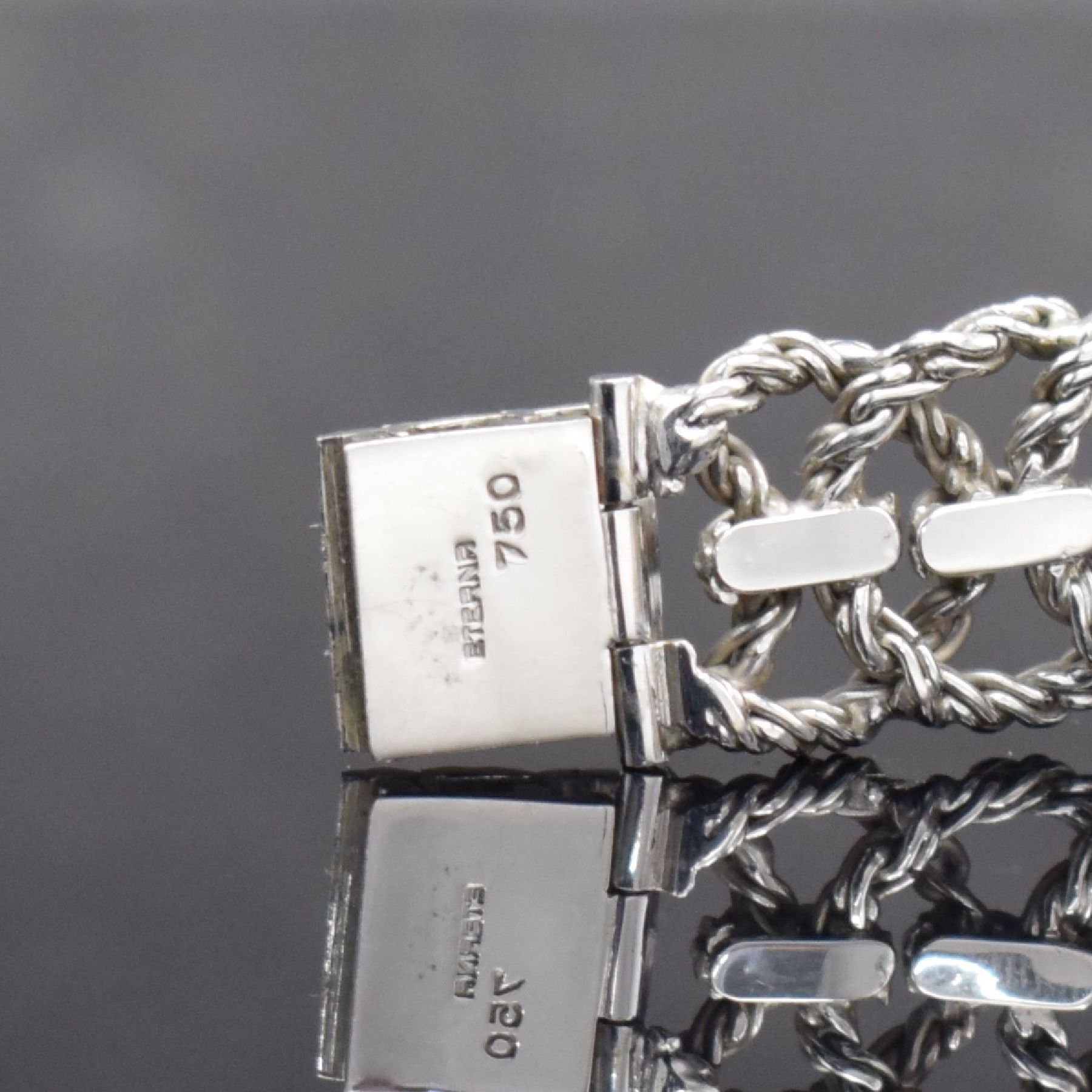 Detail e: ETERNA-MATIC ausgefallene Damenarmbanduhr in WG 750/000, Schweiz um 1970, Automatik, Boden aufgedr., aufwendiges Flechtband in WG 750/000, silb. ...