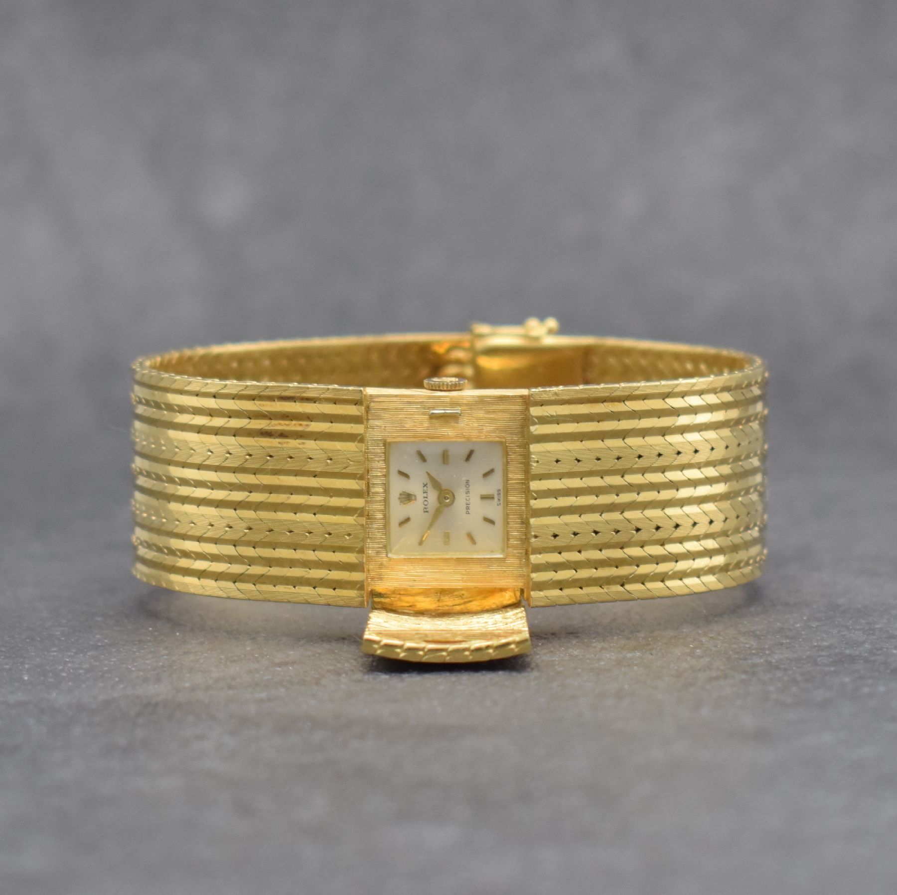ROLEX seltene Damenarmbanduhr in Bandform, Schweiz um 1960, Handaufzug, GG 750/000, v. Gehäuse ins Band übergehendes Design m. aufklappbarem ...