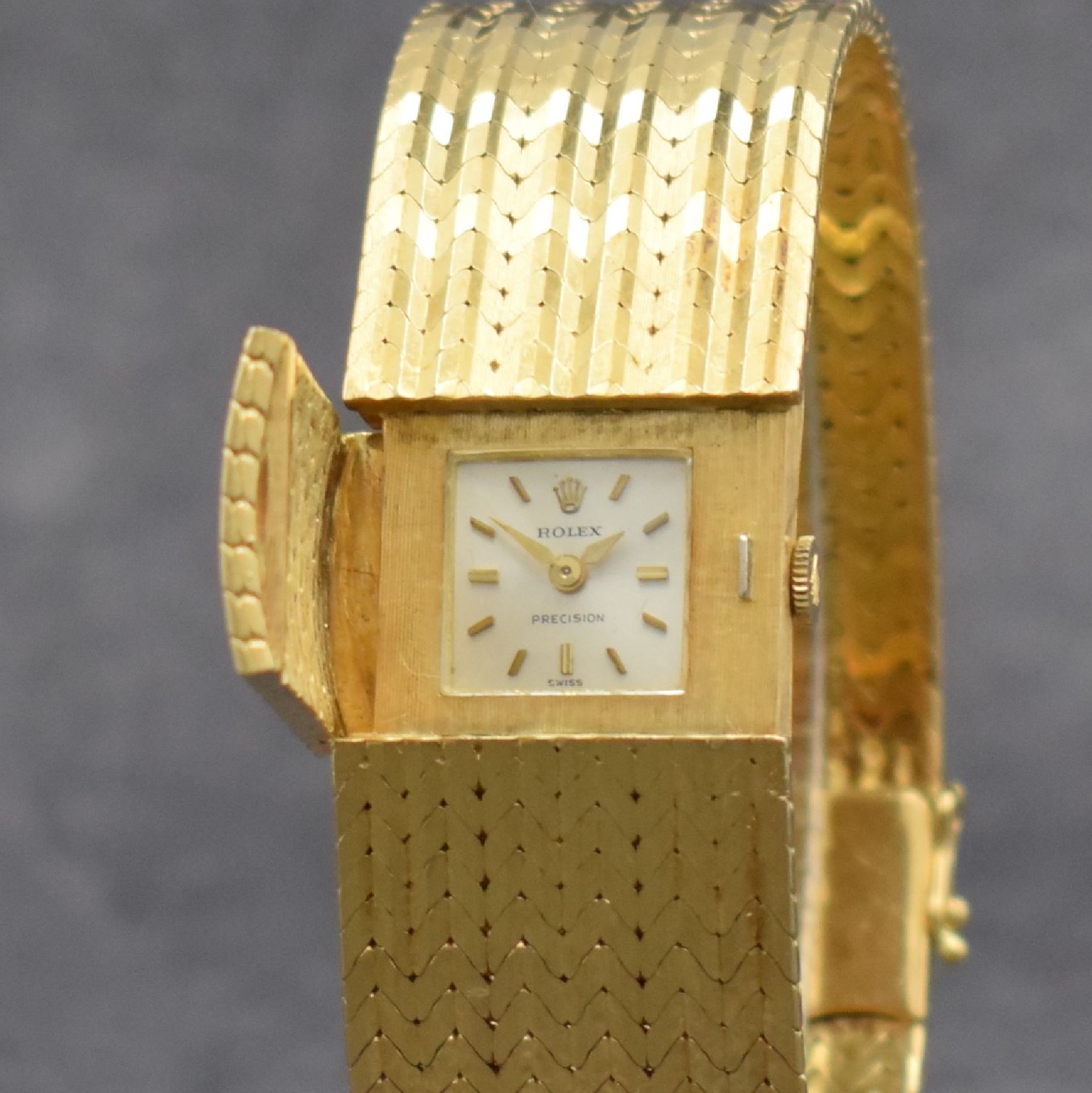 Detail d: ROLEX seltene Damenarmbanduhr in Bandform, Schweiz um 1960, Handaufzug, GG 750/000, v. Gehäuse ins Band übergehendes Design m. aufklappbarem ...