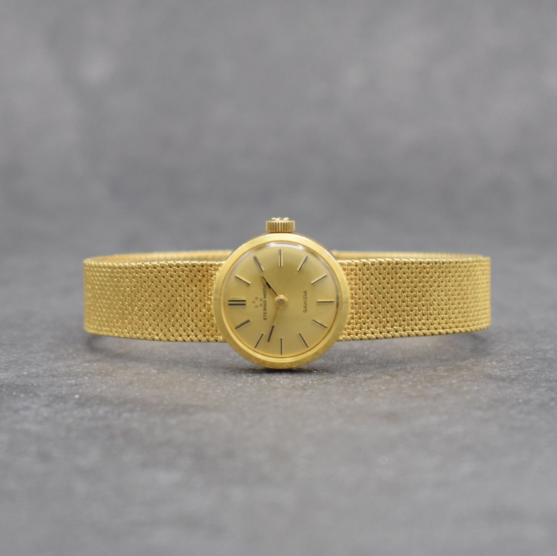 ETERNA Sahida Damenarmbanduhr in GG 750/000, Schweiz um 1965, Automatik, gedr. Geh. am orig. Milanaiseband, orig. Krone & Glas, gold. Zifferbl., ...