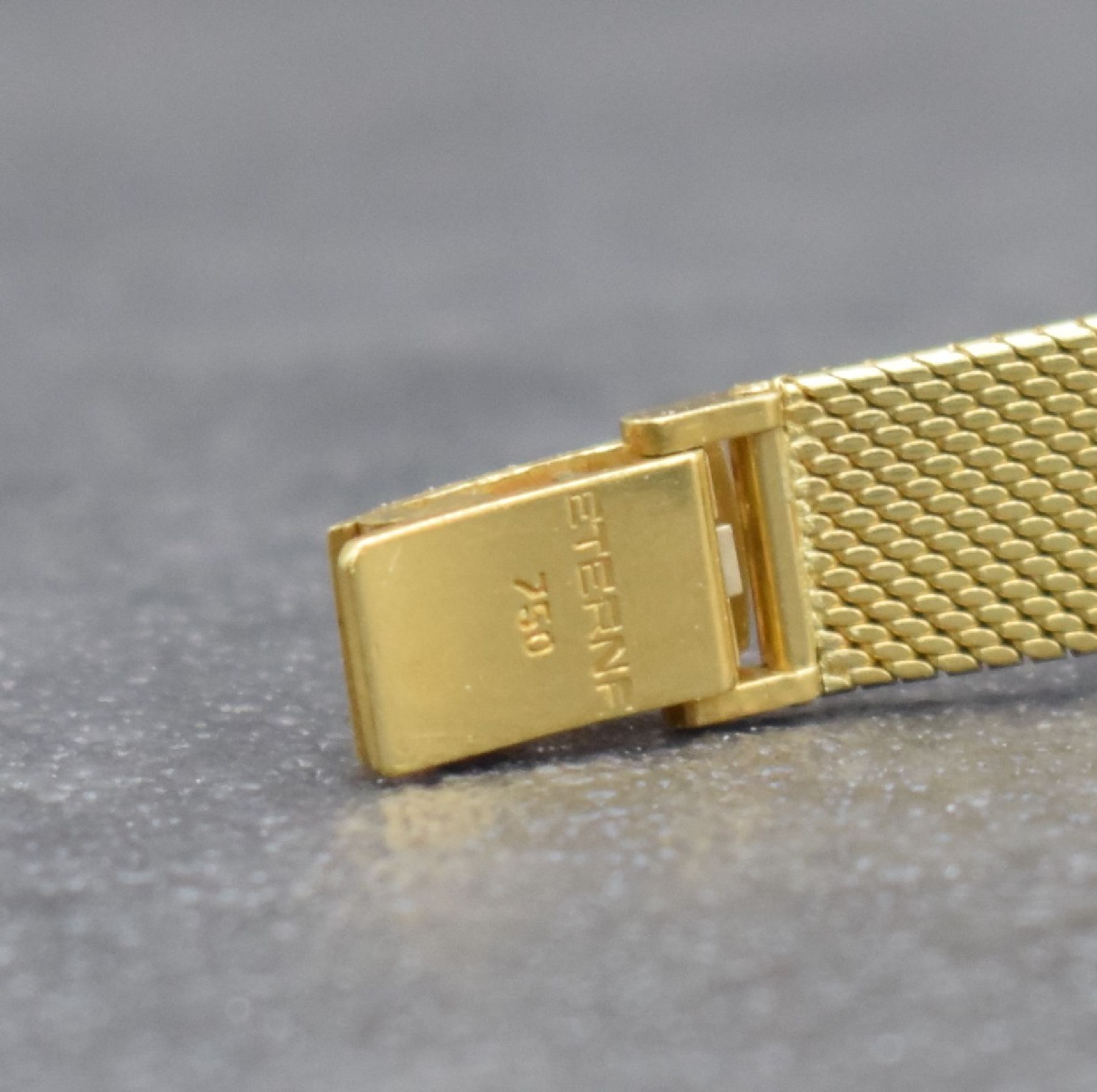 Detail e: ETERNA Sahida Damenarmbanduhr in GG 750/000, Schweiz um 1965, Automatik, gedr. Geh. am orig. Milanaiseband, orig. Krone & Glas, gold. Zifferbl., ...