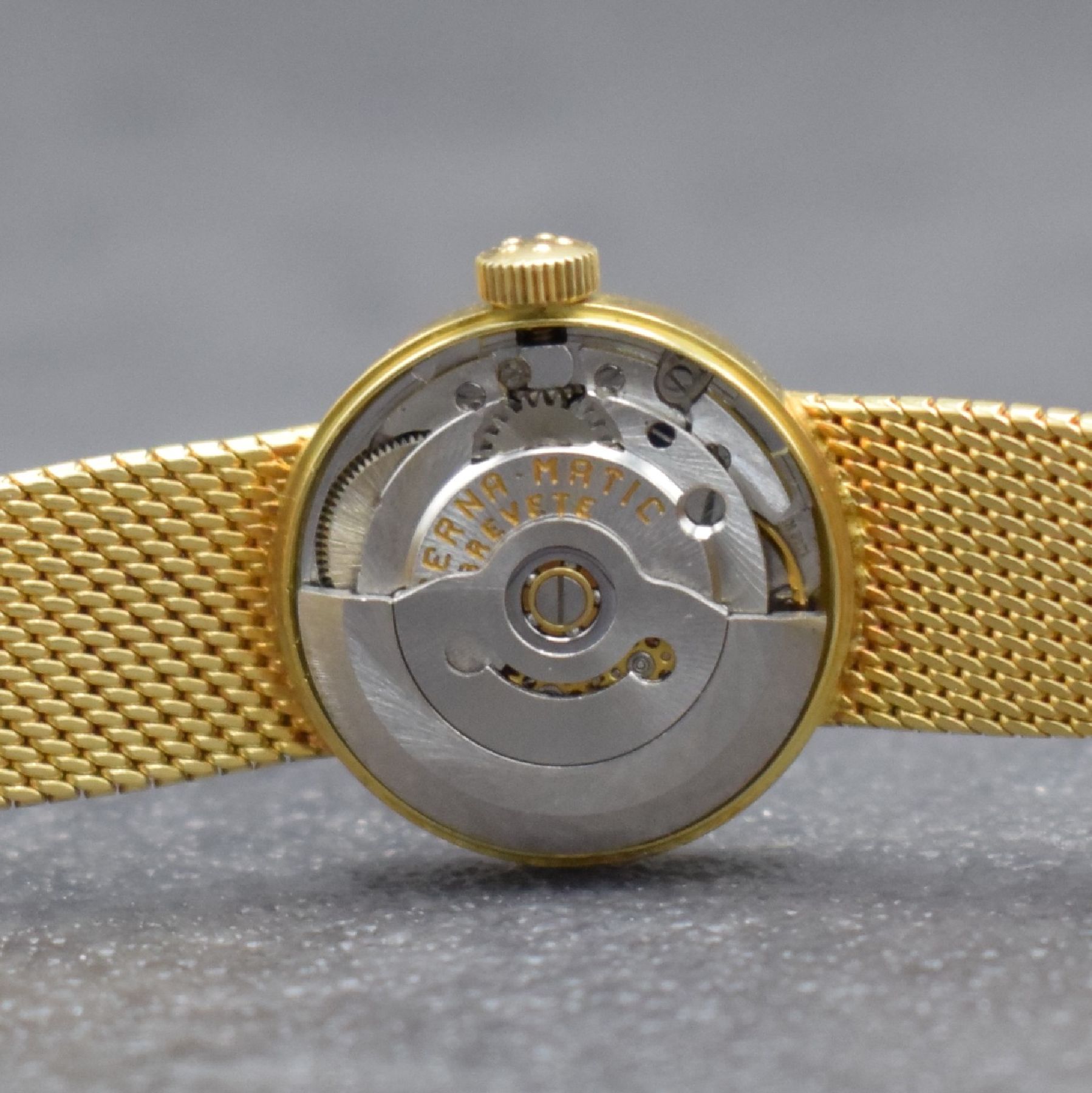 Detail i: ETERNA Sahida Damenarmbanduhr in GG 750/000, Schweiz um 1965, Automatik, gedr. Geh. am orig. Milanaiseband, orig. Krone & Glas, gold. Zifferbl., ...