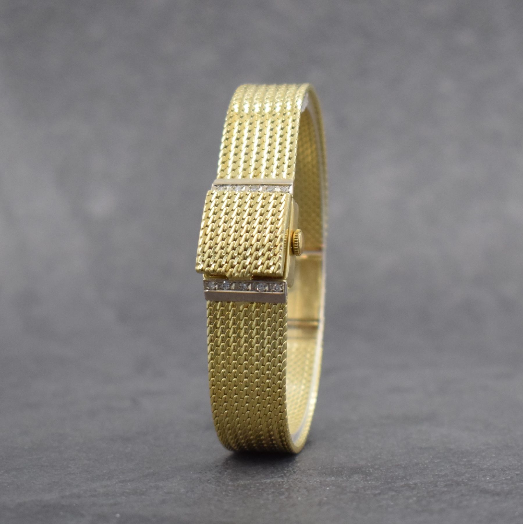 Detail c: RHODOS Diamantbesetzte Damenarmbanduhr in GG 585/000, Schweiz um 1965, Handaufzug, durchgehendes Milanaiseband, silb. Zifferbl. unter ...