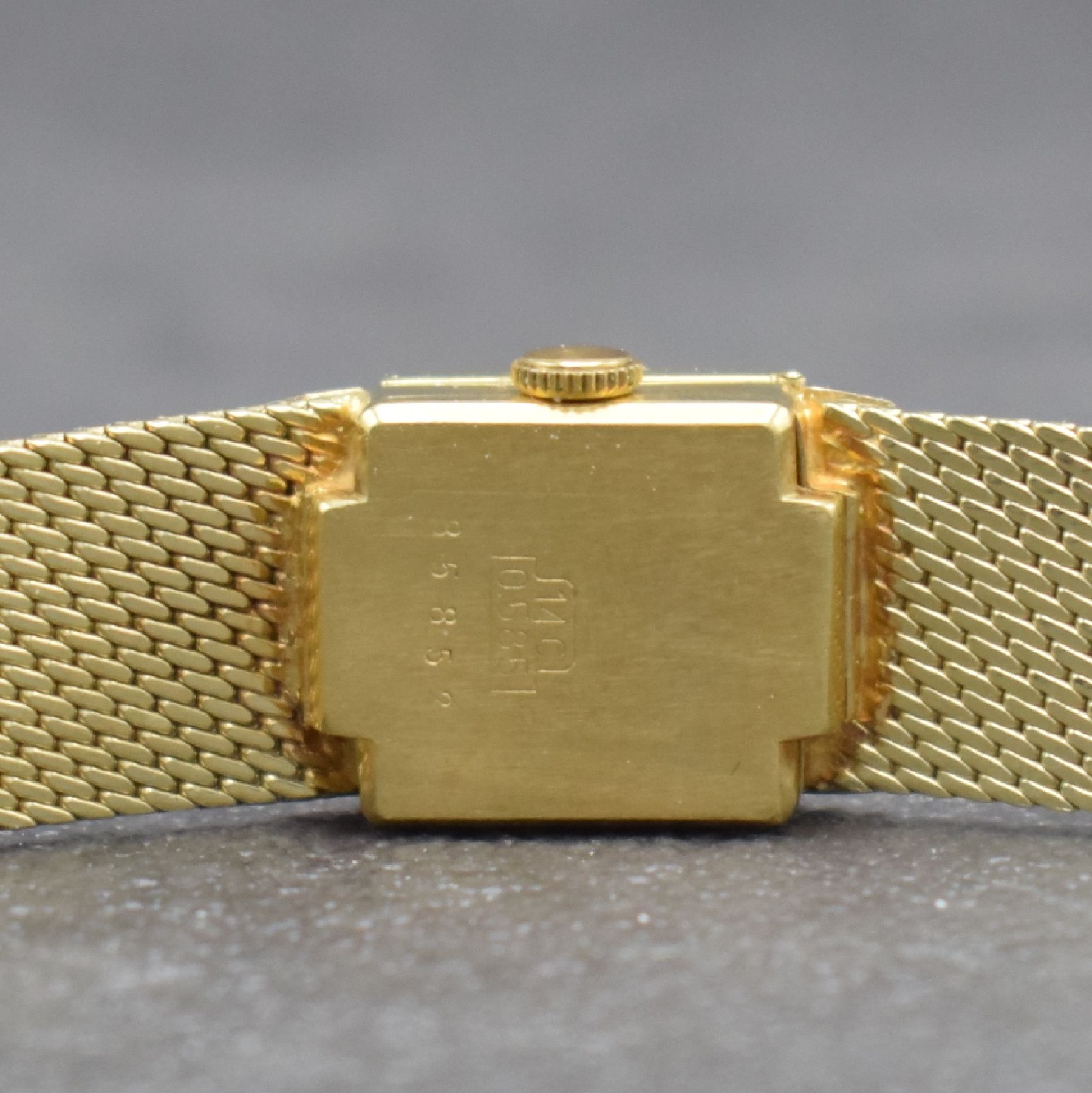 Detail e: RHODOS Diamantbesetzte Damenarmbanduhr in GG 585/000, Schweiz um 1965, Handaufzug, durchgehendes Milanaiseband, silb. Zifferbl. unter ...