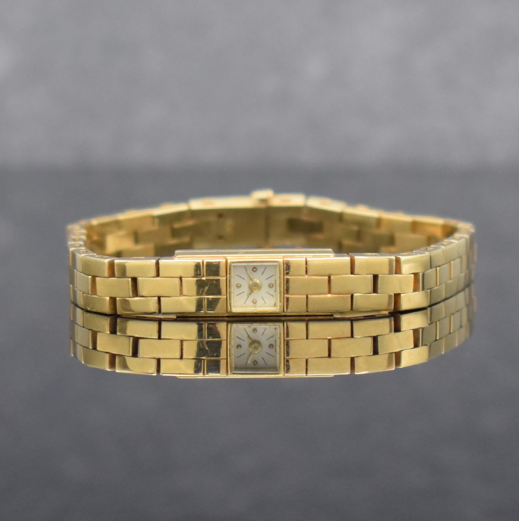LeCOULTRE Duo-Plan Damenarmbanduhr in GG 750/000, Schweiz um 1945, Handaufzug, 2-fach verschr. Baguette-Geh., integr. 3-reihiges Backsteinband, ...