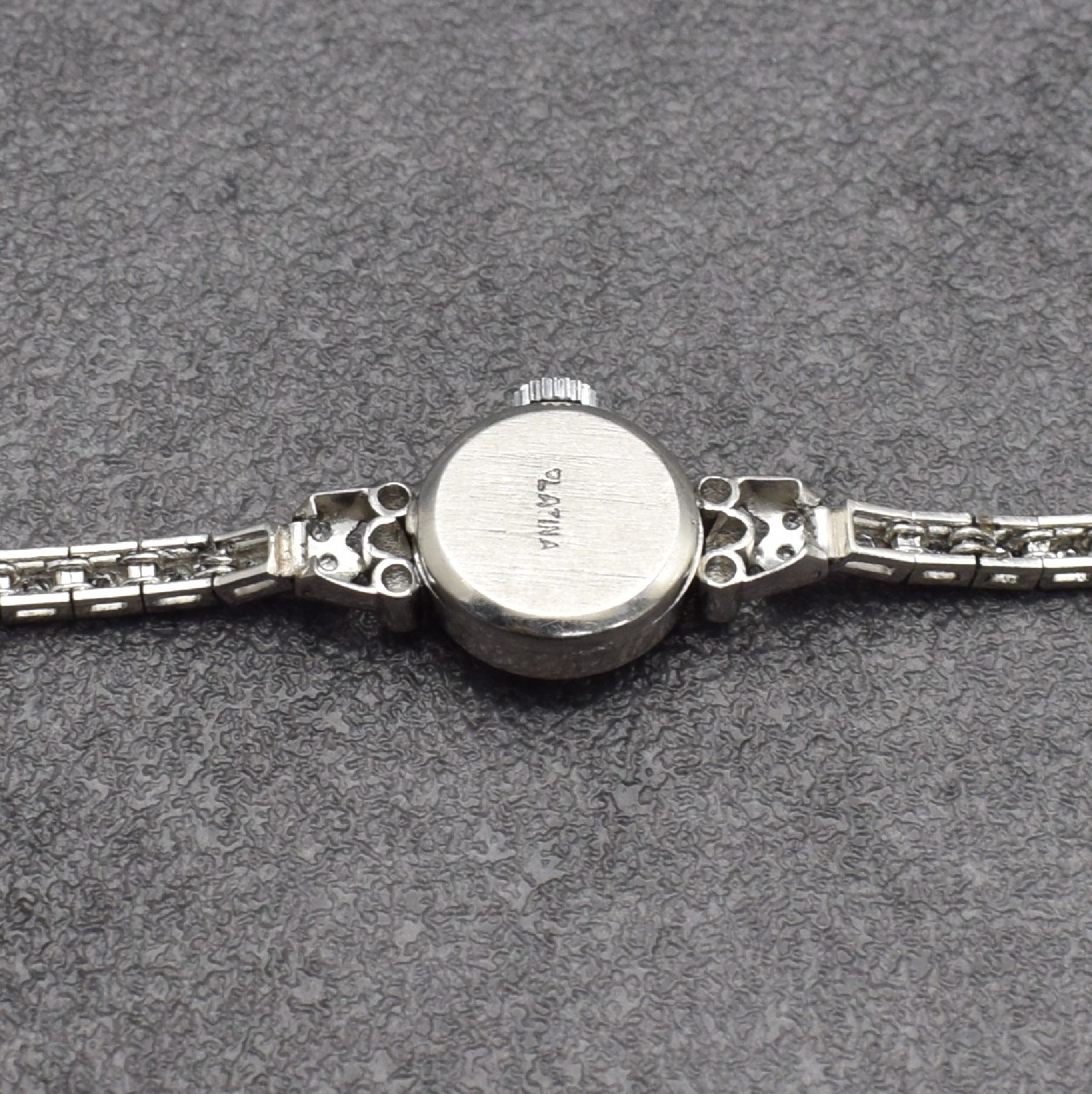 Detail b: ROYCE Diamantbesetzte Damenuhr in Platin, um 1945, Handaufzug, gedr. Geh. sowie orig. Platinband m. ca. 1,0 ct Diamanten bes., silb. Zifferbl. pat., ...