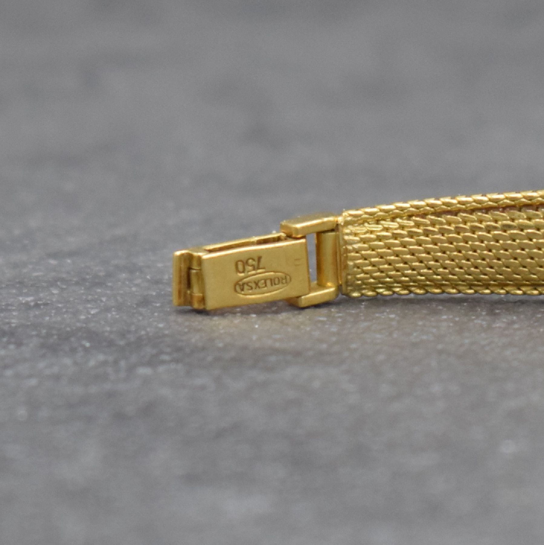 Detail c: ROLEX Damengoldbanduhr in GG 750/000, Schweiz um 1950, Handaufzug, gedr. Geh., anges. Milanaiseband zum Geh. gerafft, silb. Zifferbl., gold. Indizes ...