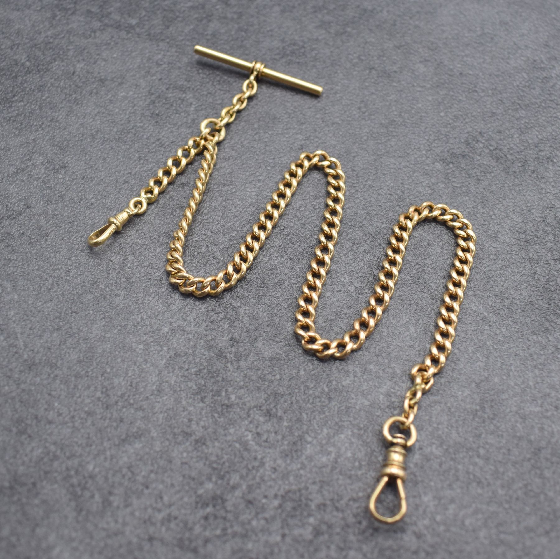 Taschenuhrkette in RoseG 585/000, um 1900, mit 2 Karabiner & Knebel, L. ca. 38 cm, Gew. ca. 36g, verwendb., aus dem Nachlass eines Sammlers