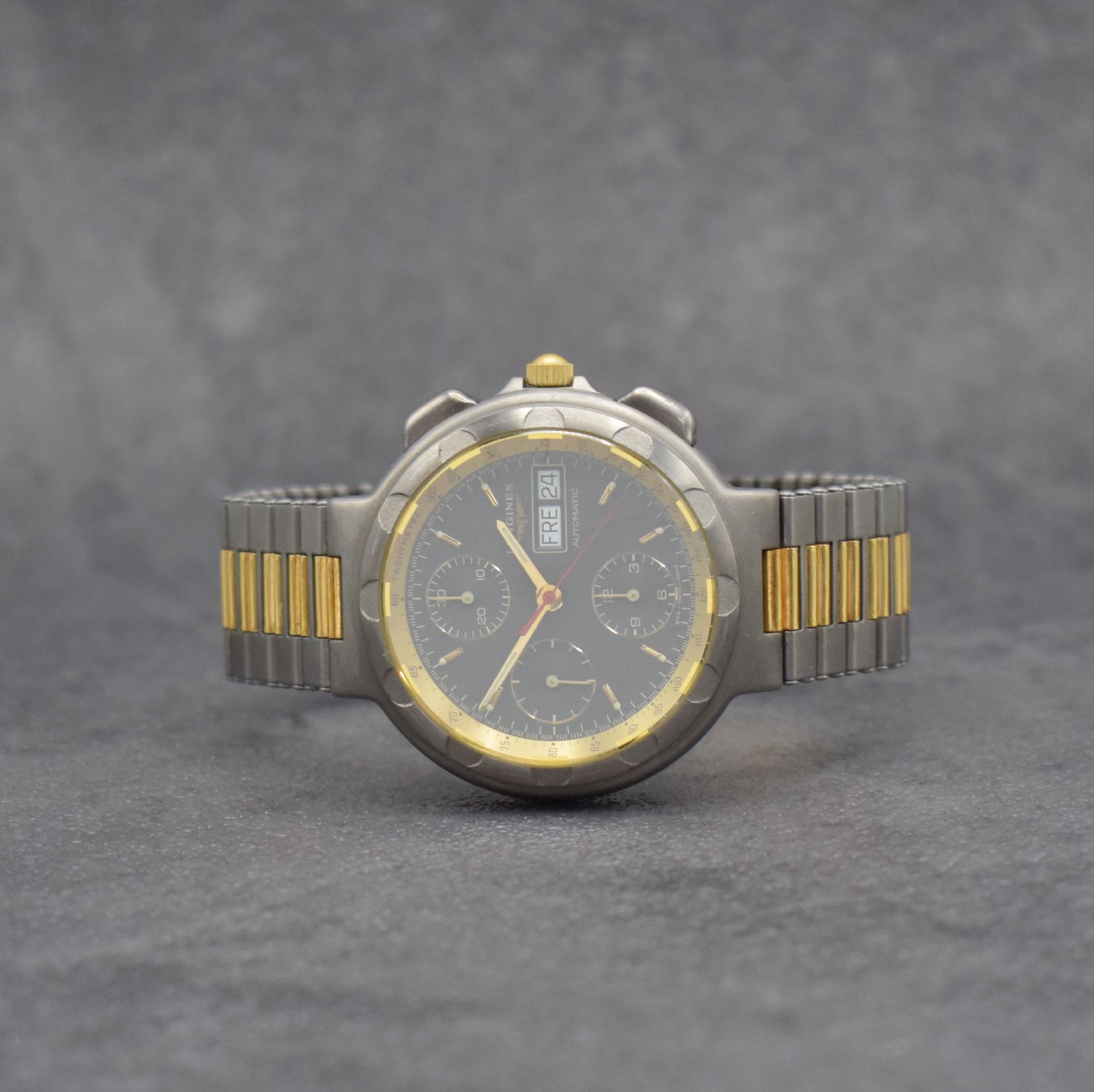 LONGINES Conquest Herrenchronograph in Stahl/ vergoldet, Schweiz um 1980, Automatik, mattiertes Geh. m. integr. Band, Boden aufgedr., graues ...