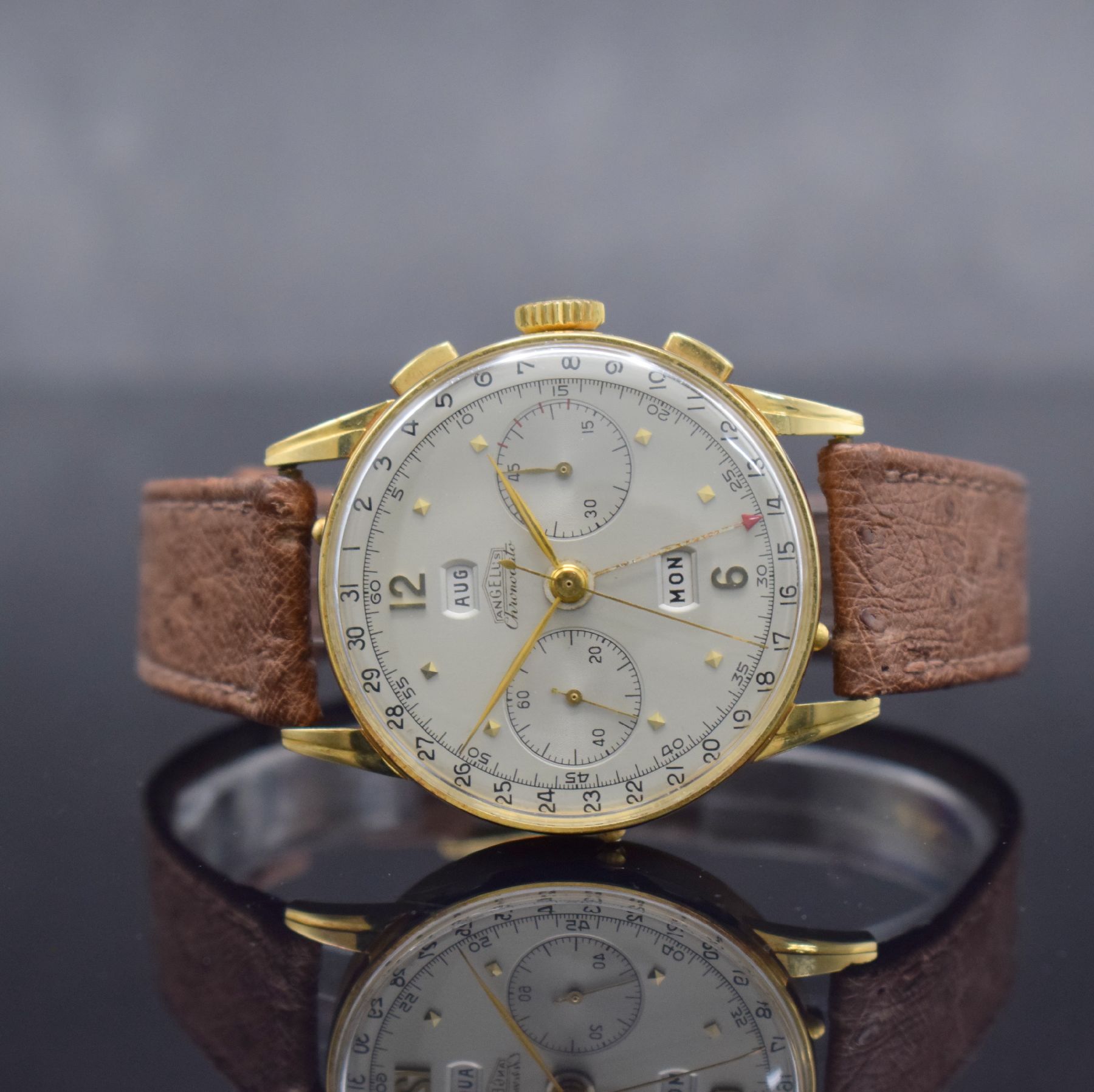 ANGELUS Chronodato seltener Schaltradchronograph mit Vollkalender in GG 750/000, Schweiz um 1945, Handaufzug, 3-tlg. Geh., Boden & Glasrand aufgedr., ...