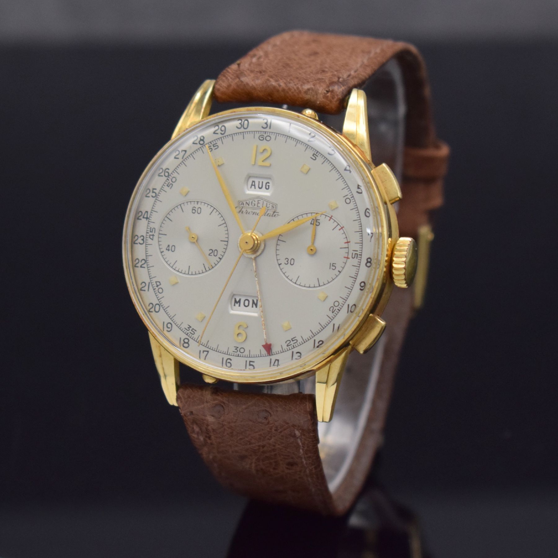 Detail b: ANGELUS Chronodato seltener Schaltradchronograph mit Vollkalender in GG 750/000, Schweiz um 1945, Handaufzug, 3-tlg. Geh., Boden & Glasrand aufgedr., ...