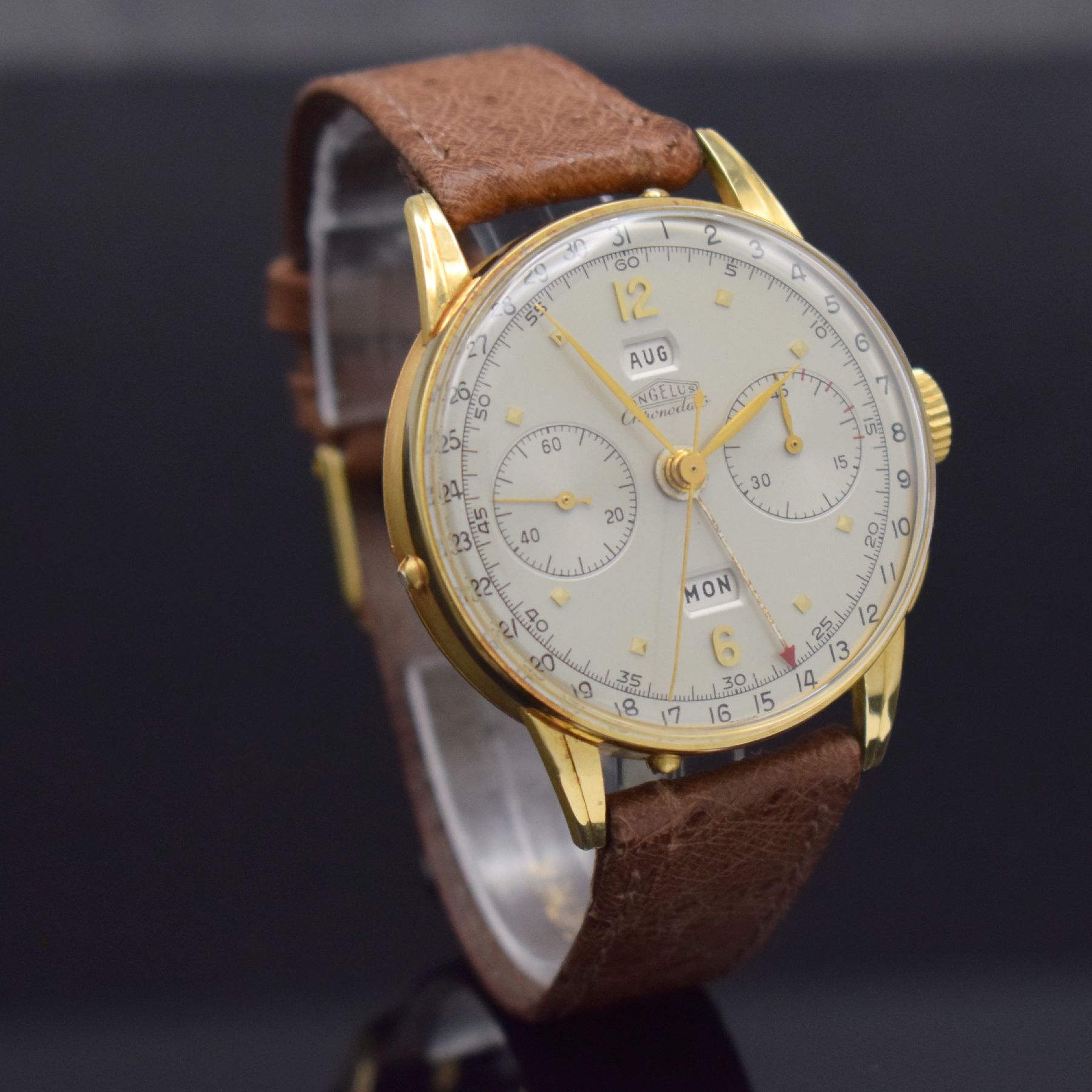Detail d: ANGELUS Chronodato seltener Schaltradchronograph mit Vollkalender in GG 750/000, Schweiz um 1945, Handaufzug, 3-tlg. Geh., Boden & Glasrand aufgedr., ...