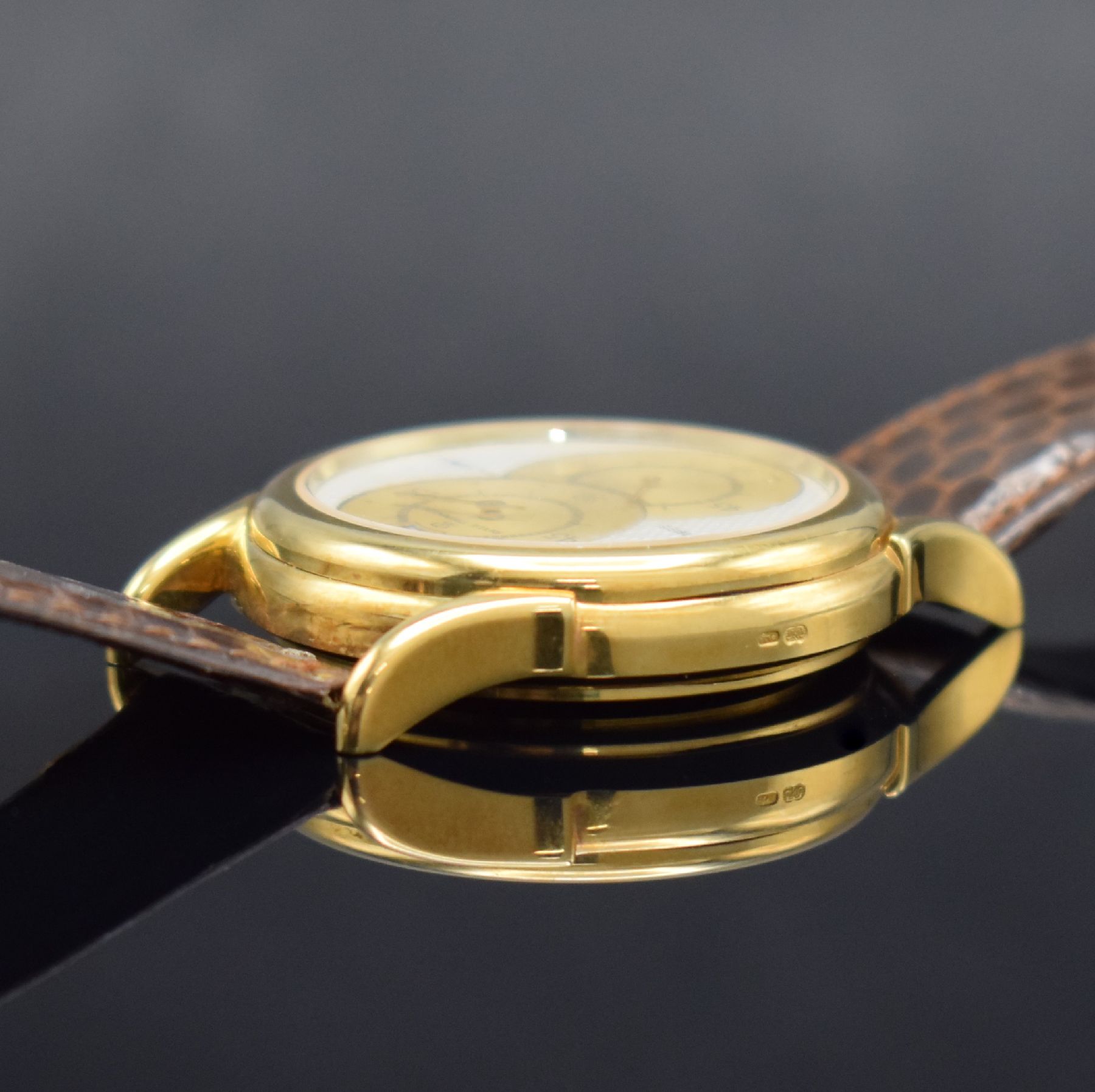 Detail e: REVUE THOMMEN Saltarello auf 300 Stück limitierte Armbanduhr mit Regulator Zifferblatt in GG 750/000, Schweiz um 1990, Handaufzug, beids. vergl. ...