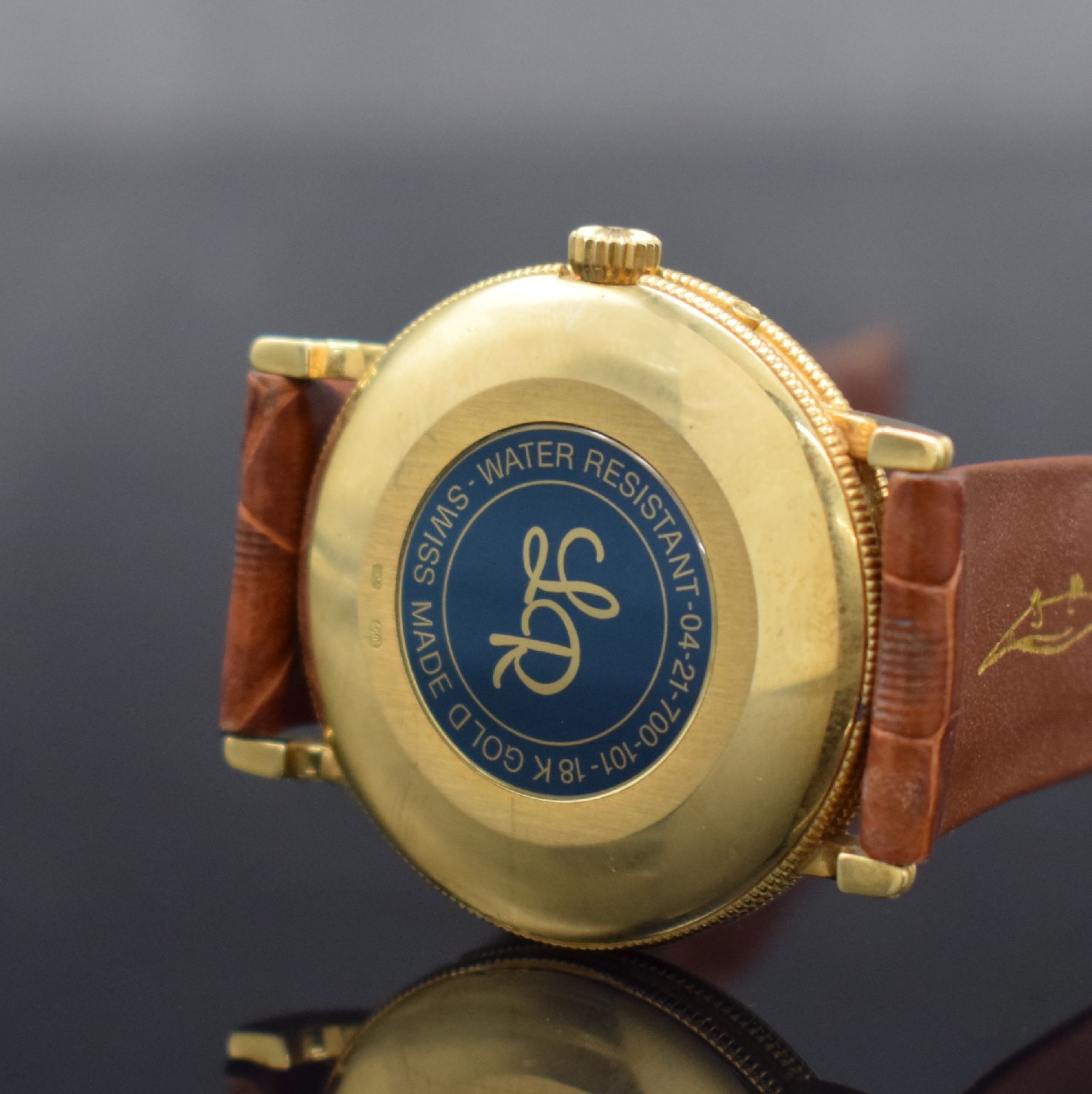Detail e: LUCIEN ROCHAT Vollkalender-Herrenarmbanduhr in GG 750/000, Schweiz um 1990, Automatik, 3-tlg. gedr. Geh., Lünette, Anstöße & Rand geriffelt, ...