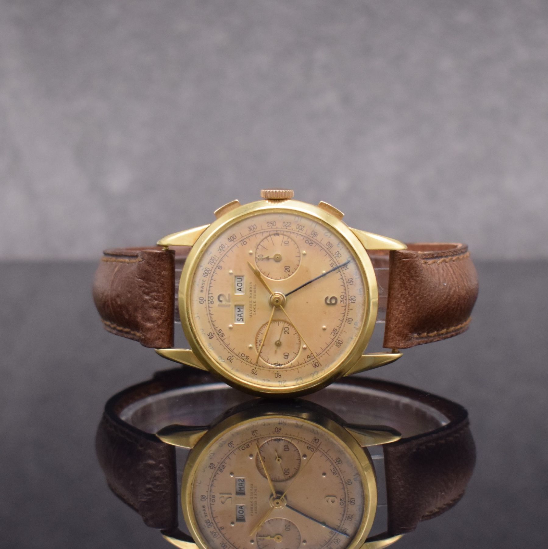ULYSSE NARDIN extrem seltener Schaltradchronograph mit Vollkalender Kaliber 23C in GG 750/000, Handaufzug, Schweiz um 1945, 3-teil. Geh., Boden & ...