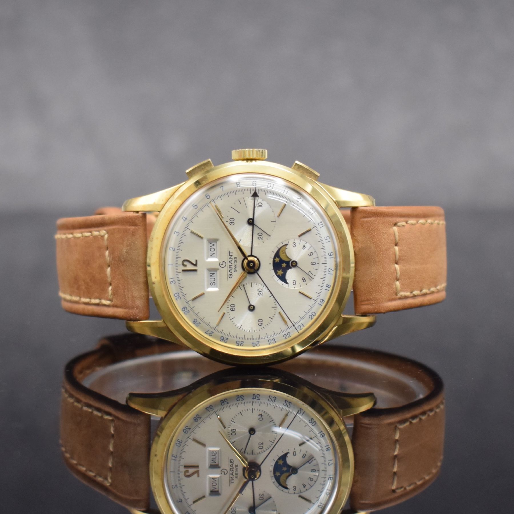 GARANT Herrenarmbanduhr mit Vollkalender & Chronograph in GG 750/000 mit Kaliber Valjoux 72, Schweiz um 1980, 3-teil. Gehäuse sign. Mathey-Tissot, ...