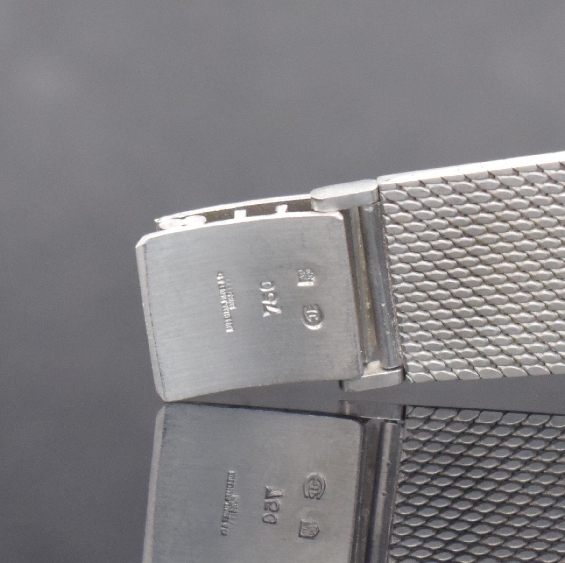 Detail e: AUDEMARS PIGUET feine Herrenarmbanduhr in WG 750/000, Automatik, Schweiz um 1970, 2-teil. Geh., Boden aufgedr., Milanaiseband, vers. Zifferbl. m. ...
