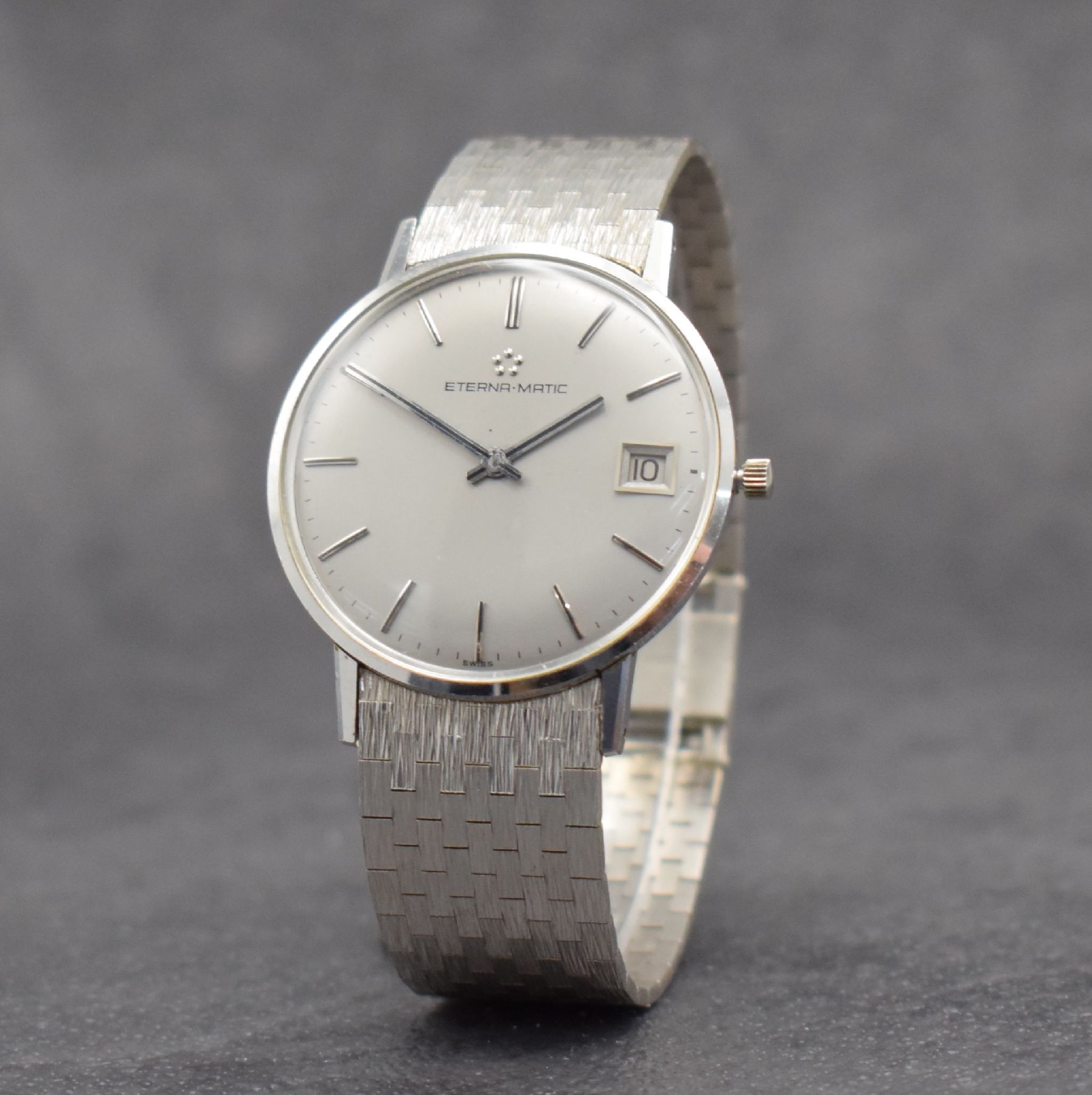 Detail b: ETERNA-MATIC Herrenarmbanduhr in WG 750/000, Schweiz um 1965, Automatik, Boden aufgedr., inkl. Band in WG 750/000, silb. Zifferbl. m. aufges. ...