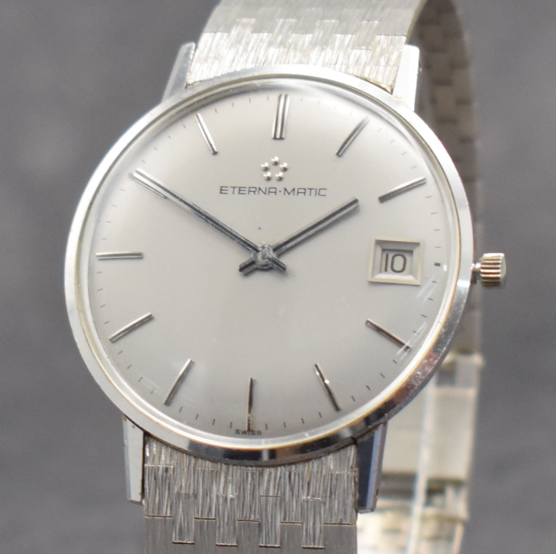Detail c: ETERNA-MATIC Herrenarmbanduhr in WG 750/000, Schweiz um 1965, Automatik, Boden aufgedr., inkl. Band in WG 750/000, silb. Zifferbl. m. aufges. ...