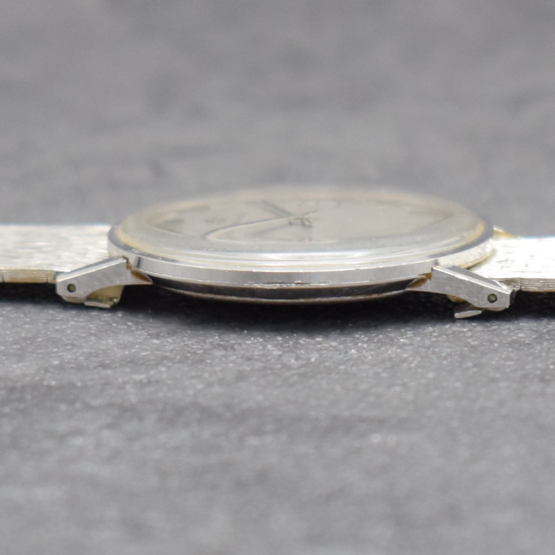 Detail g: ETERNA-MATIC Herrenarmbanduhr in WG 750/000, Schweiz um 1965, Automatik, Boden aufgedr., inkl. Band in WG 750/000, silb. Zifferbl. m. aufges. ...