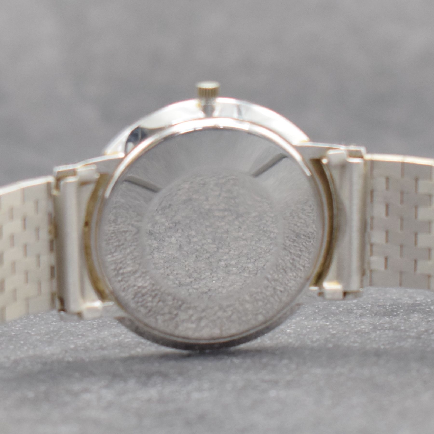 Detail h: ETERNA-MATIC Herrenarmbanduhr in WG 750/000, Schweiz um 1965, Automatik, Boden aufgedr., inkl. Band in WG 750/000, silb. Zifferbl. m. aufges. ...