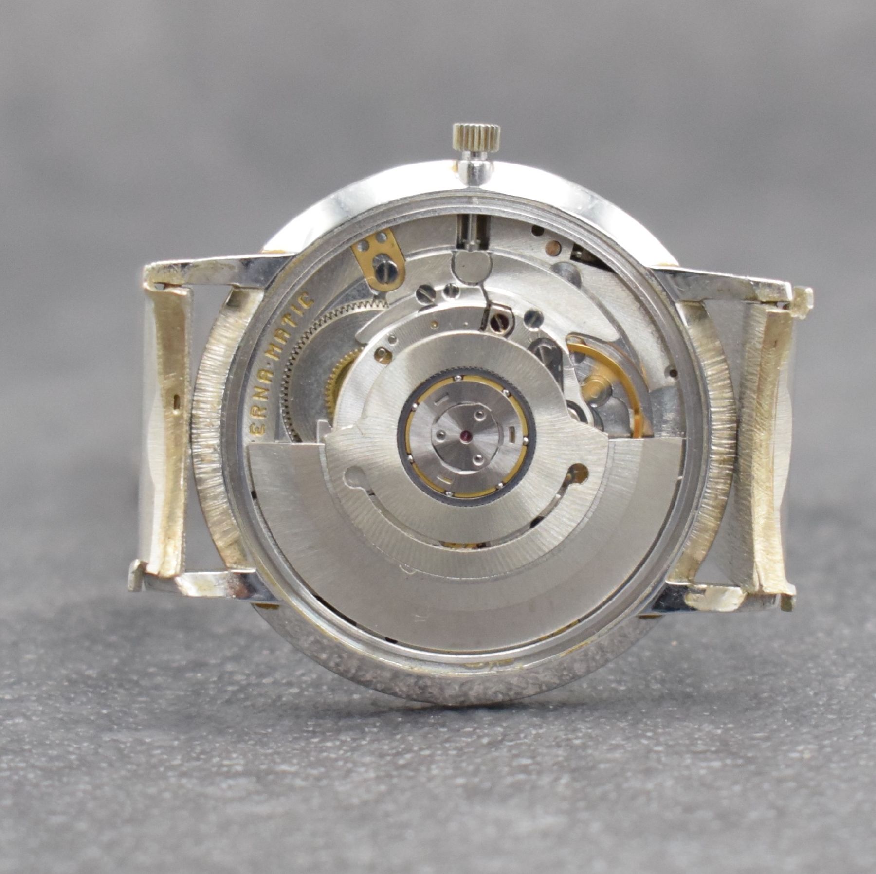 Detail i: ETERNA-MATIC Herrenarmbanduhr in WG 750/000, Schweiz um 1965, Automatik, Boden aufgedr., inkl. Band in WG 750/000, silb. Zifferbl. m. aufges. ...