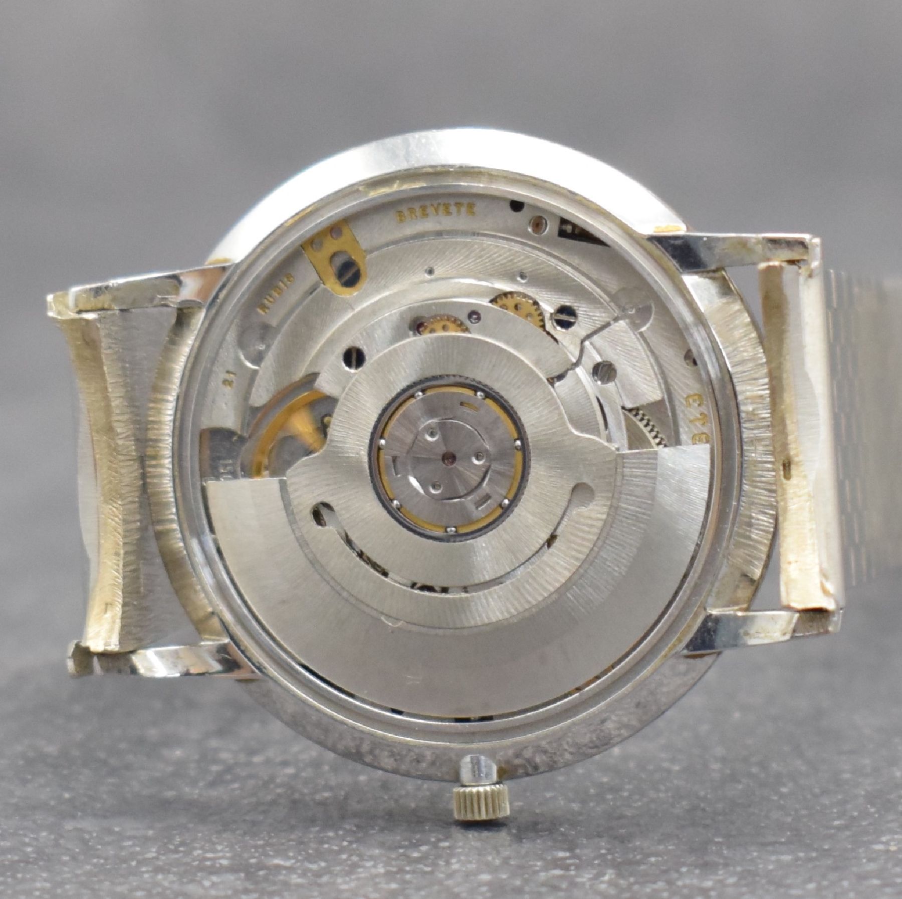 Detail j: ETERNA-MATIC Herrenarmbanduhr in WG 750/000, Schweiz um 1965, Automatik, Boden aufgedr., inkl. Band in WG 750/000, silb. Zifferbl. m. aufges. ...