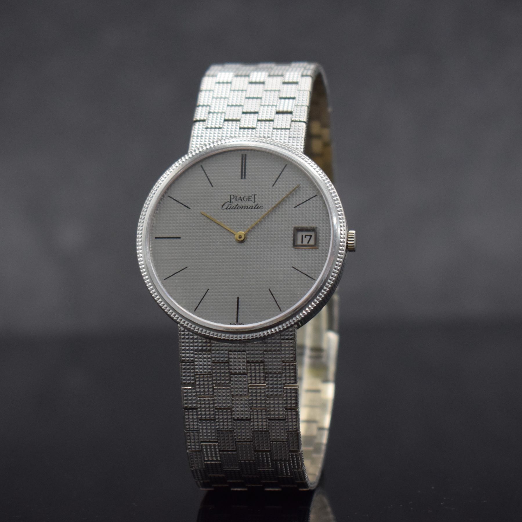 Detail b: PIAGET Armbanduhr in WG 750/000, Schweiz um 1980, Automatik, Ref. 13601 C4, massives Geh.,Boden aufgedr., silb. Zifferbl. fl., gold. Zeiger, Datum, ...