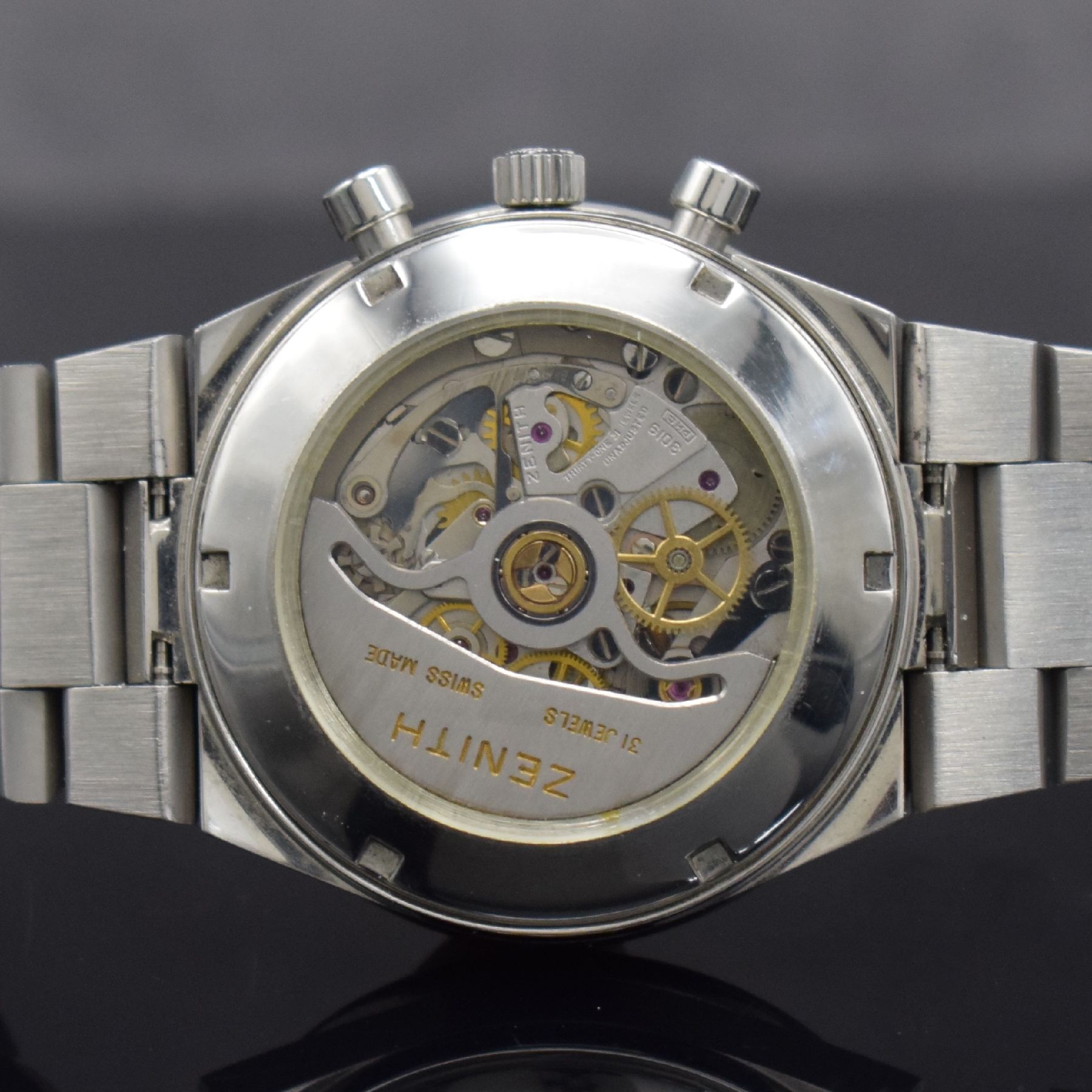 Detail g: MOVADO / ZENITH Herrenarmbanduhr mit Chronograph, Schweiz um 1980, Automatik, Edelstahlgeh., orig. Gliederbd., geschr. Boden m. später. Verglasung, ...
