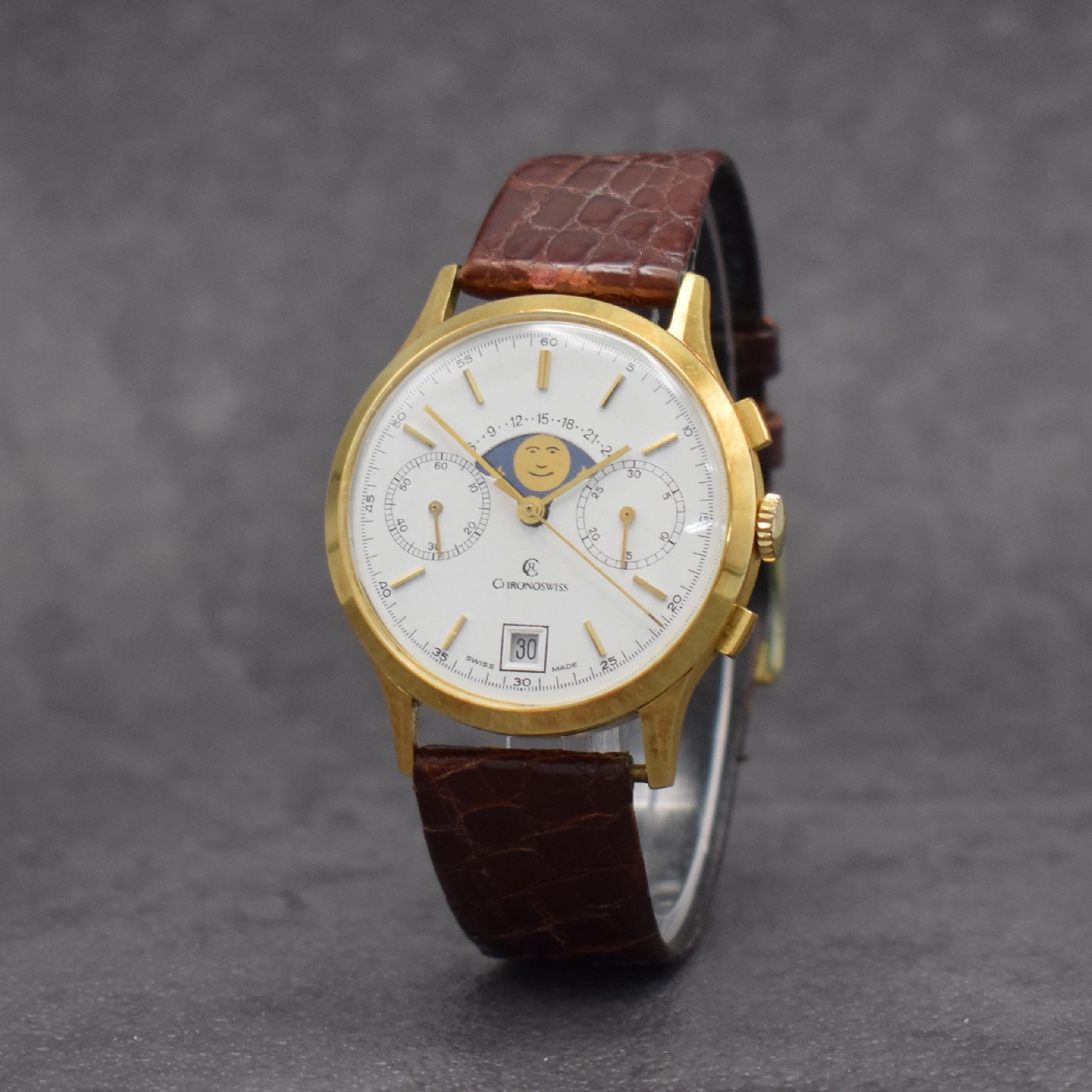 Detail b: CHRONOSWISS Herrenarmbanduhr mit Chronograph, Mondphase & Datum in GG 750/000, Schweiz um 1980, Handaufzug, 3-teil. Geh., Boden & Glasrand aufgedr., ...
