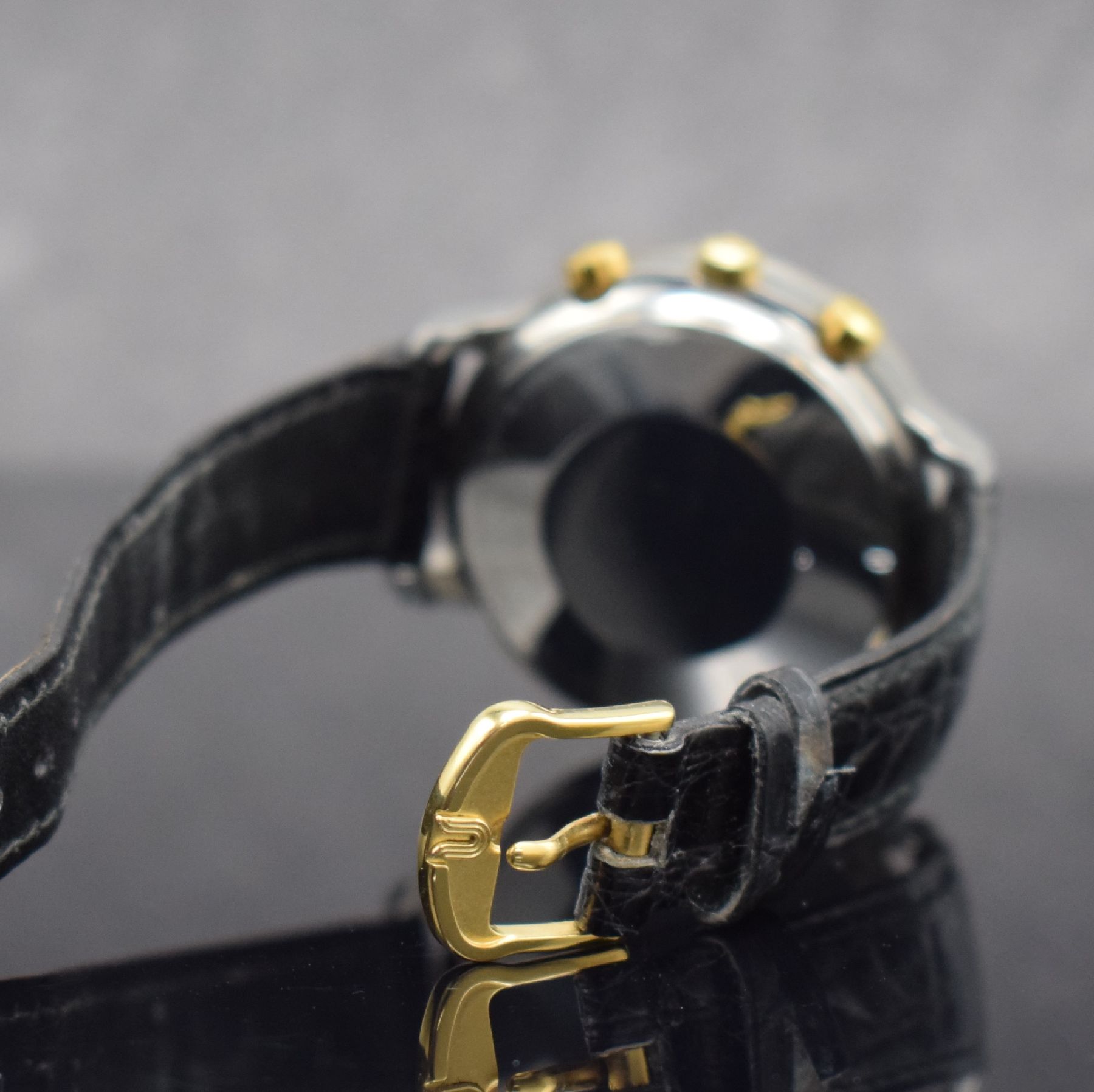Detail b: UNIVERSAL GENEVE Herrenarmbanduhr mit Chronograph & Vollkalender, Schweiz um 1990, Automatik, Edelstahlgeh., GG 750/000 Lünette m. Clous de Paris ...