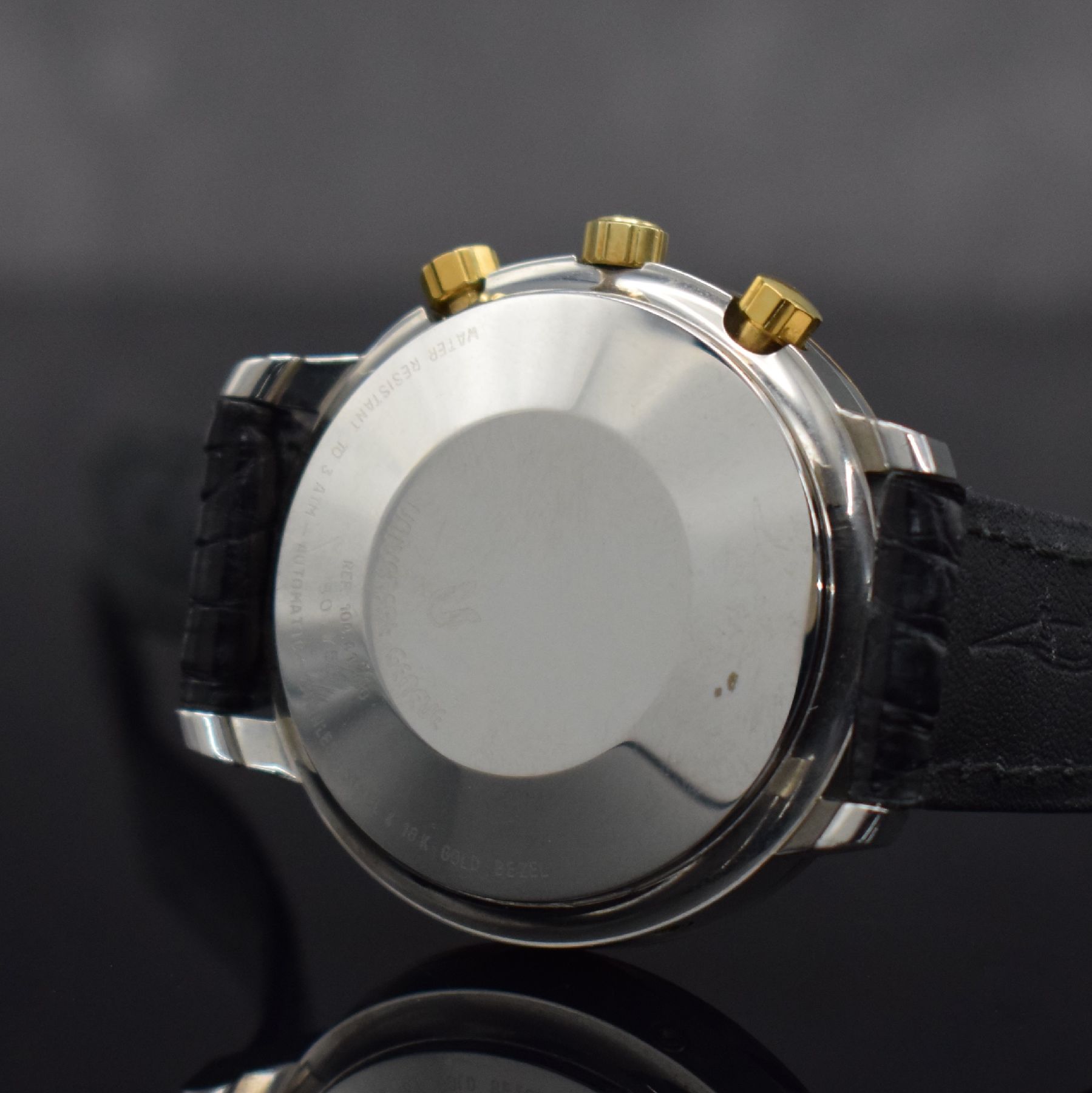 Detail e: UNIVERSAL GENEVE Herrenarmbanduhr mit Chronograph & Vollkalender, Schweiz um 1990, Automatik, Edelstahlgeh., GG 750/000 Lünette m. Clous de Paris ...